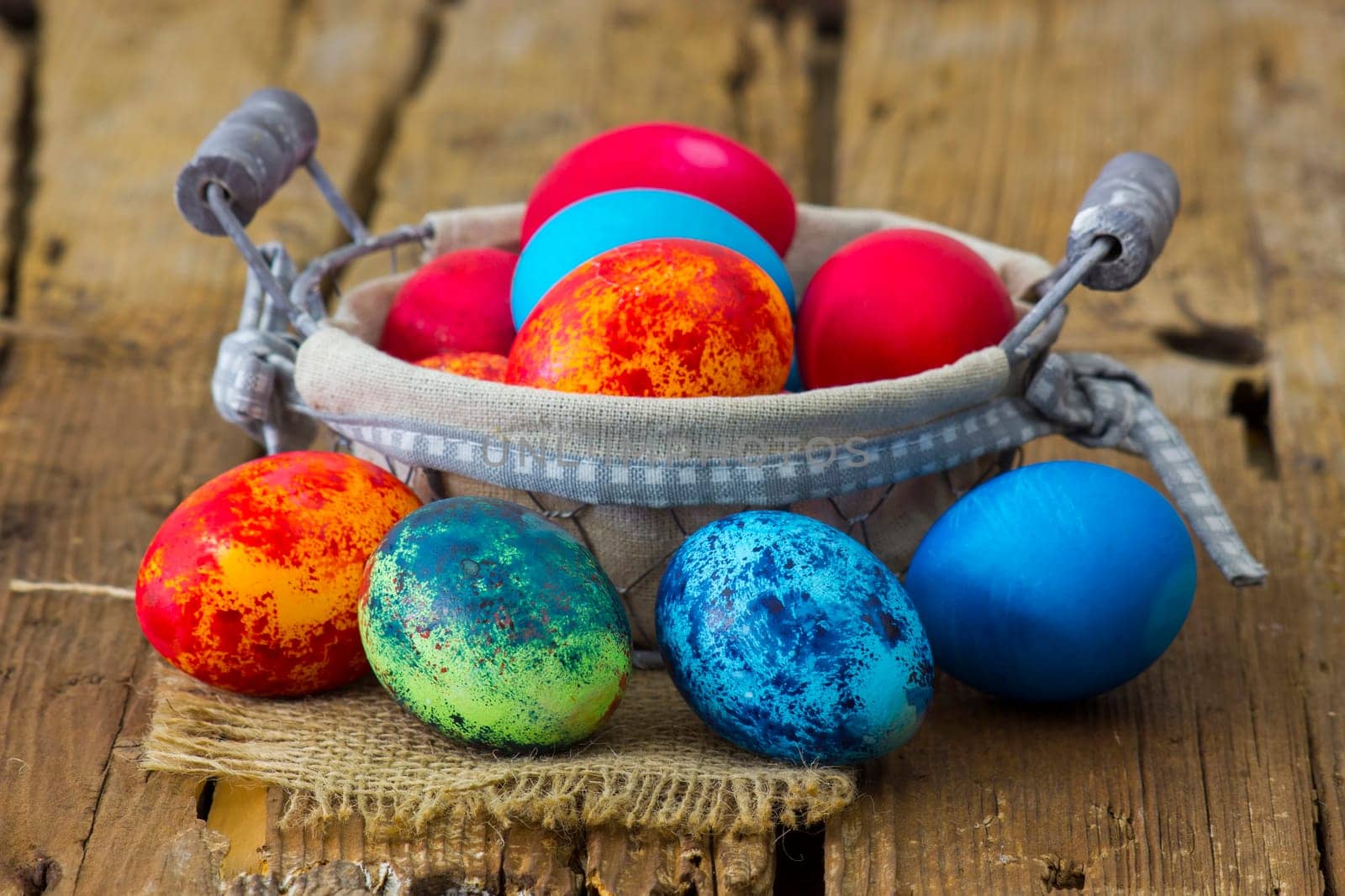Happy Easter, colorful eggs in a basket