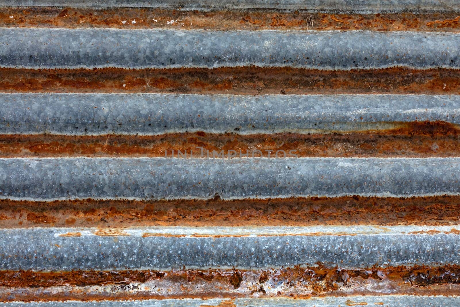 Rusty old corrugated sheet iron in Detail