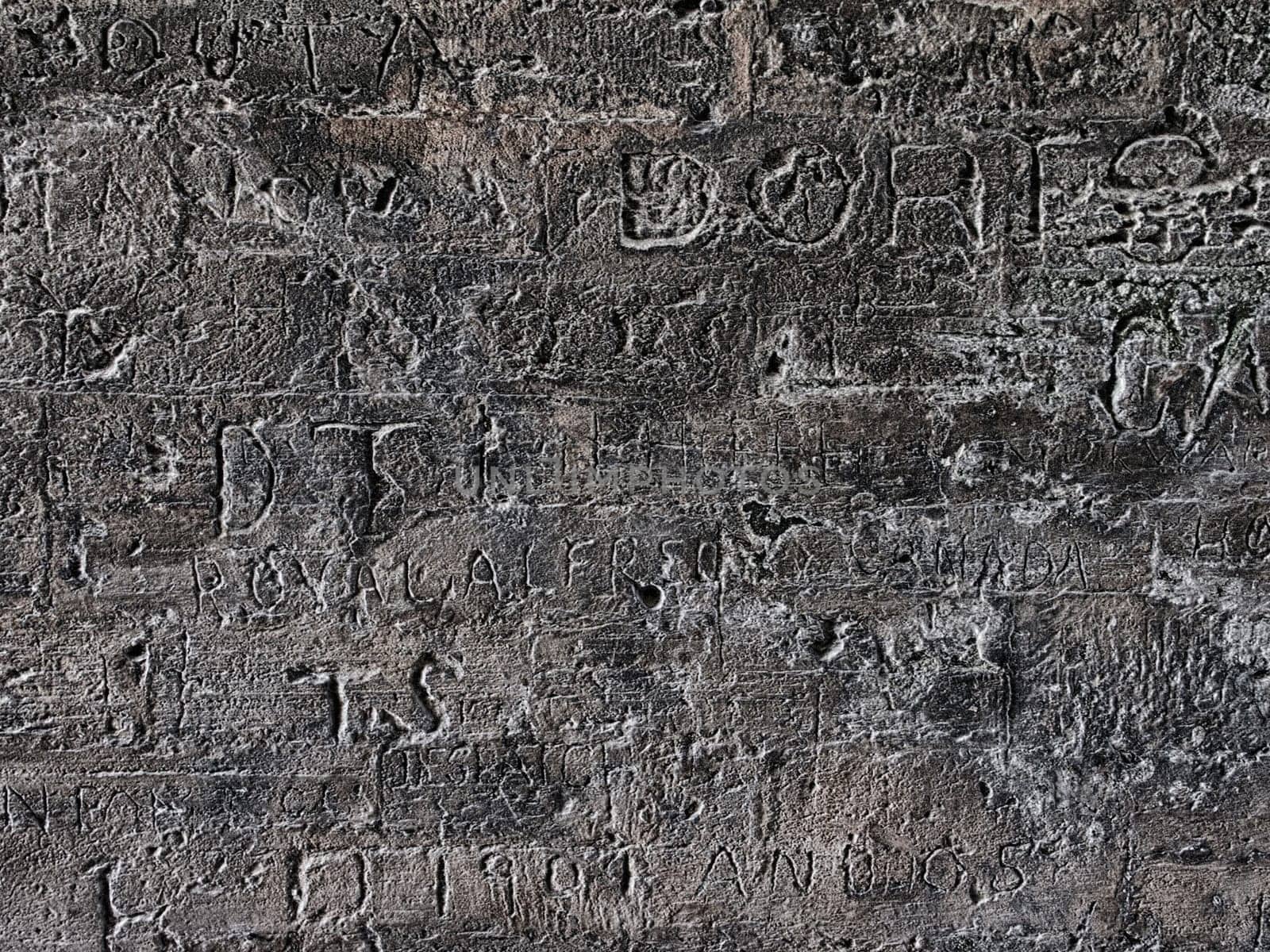 Engraved writings on stone wall
