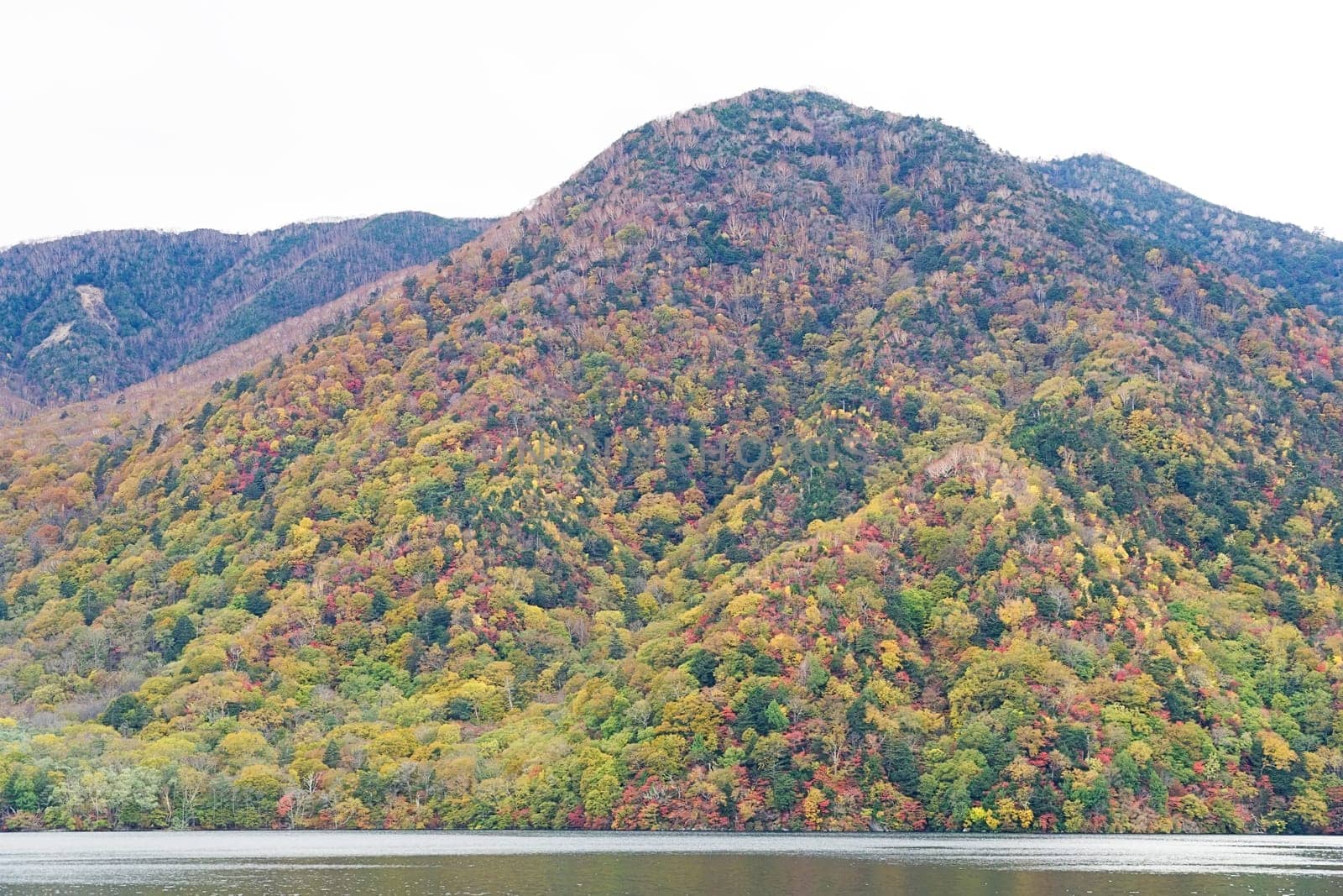 Lake Chuzenji is a scenic lake in the mountains above the town of Nikko. It is located at the foot of Mount Nantai, Nikko's sacred volcano, whose eruption blocked the valley below, thereby creating Lake Chuzenji about 20,000 years ago. This photo was shot in autumn