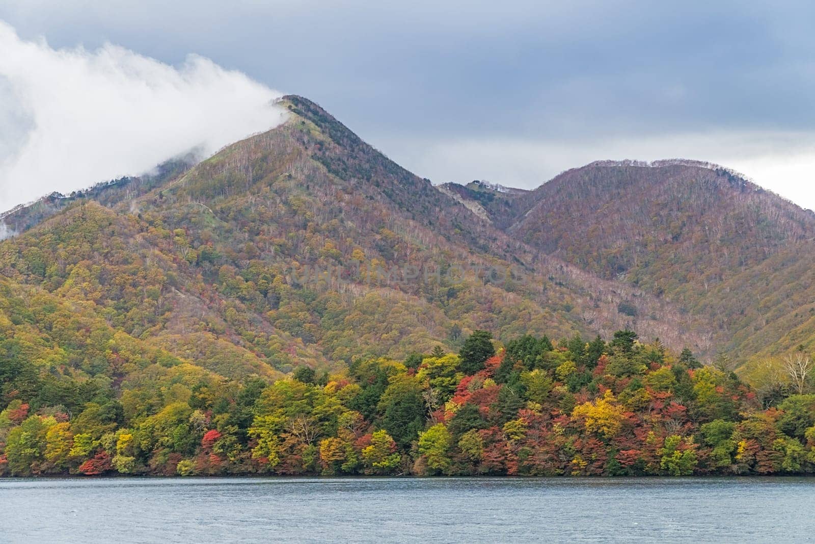Lake Chuzenji is a scenic lake in the mountains above the town of Nikko. It is located at the foot of Mount Nantai, Nikko's sacred volcano, whose eruption blocked the valley below, thereby creating Lake Chuzenji about 20,000 years ago. This photo was shot in autumn