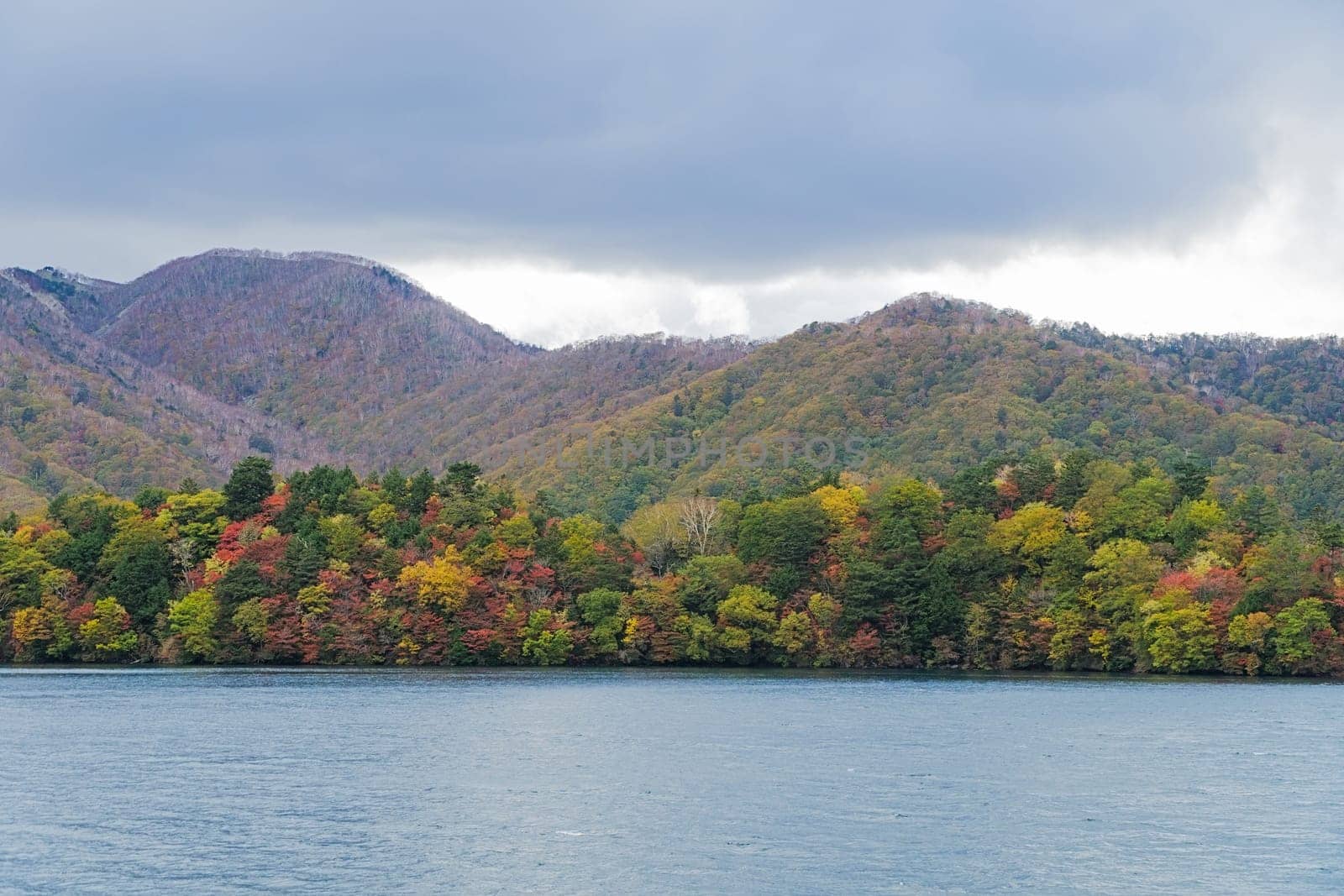 Lake Chuzenji is a scenic lake in the mountains above the town of Nikko. It is located at the foot of Mount Nantai, Nikko's sacred volcano, whose eruption blocked the valley below, thereby creating Lake Chuzenji about 20,000 years ago. This photo was shot in autumn