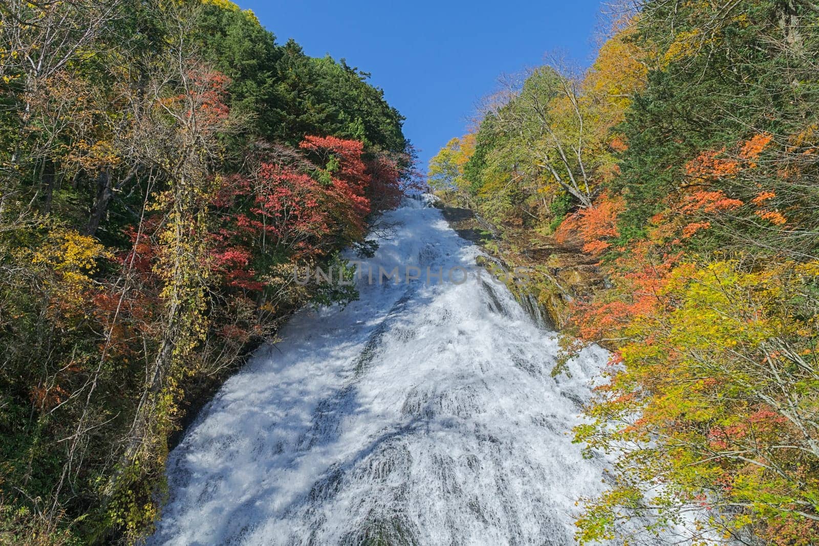 Yutaki waterfall in Nikko, Tochigi Prefecture has huge water flow down from the top especially during rainy days. There are viewing platforms halfway down the staircase by the side. It looks much prettier when there are colored leaves on both sides of the waterfall.