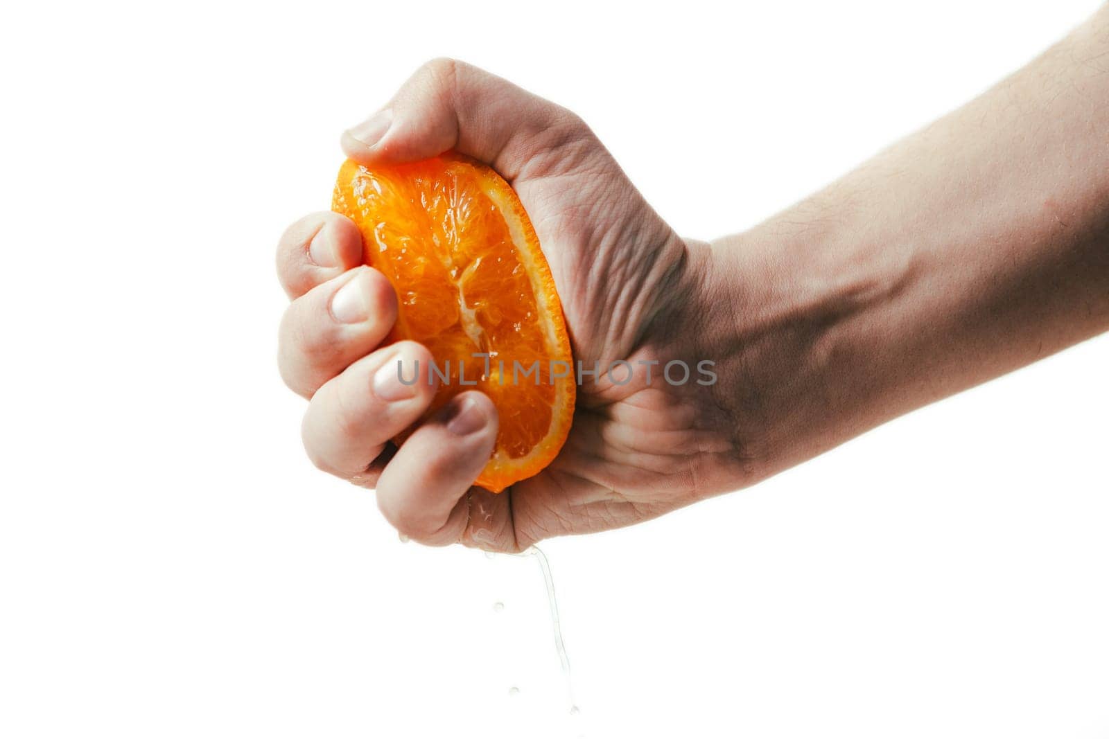 man dramatic squeezes orange. Concept squeezed a man is tired from work.