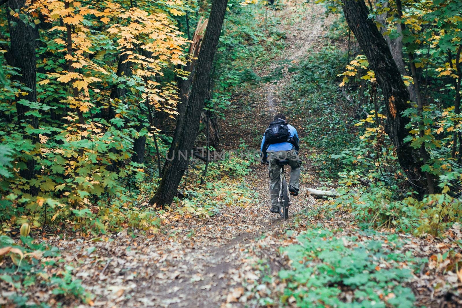 Man with bike in forest