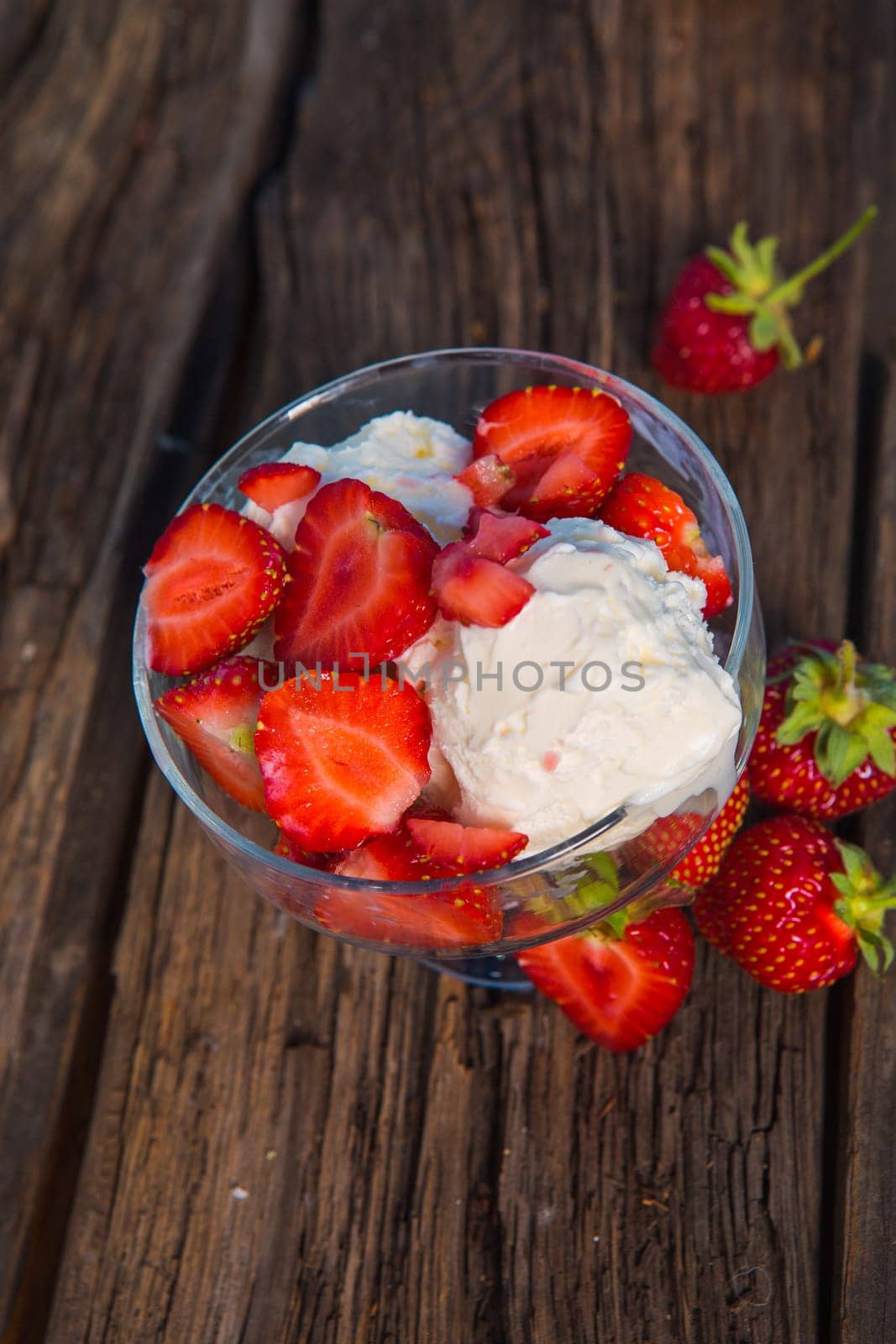 Strawberry ice cream with wooden and blue background