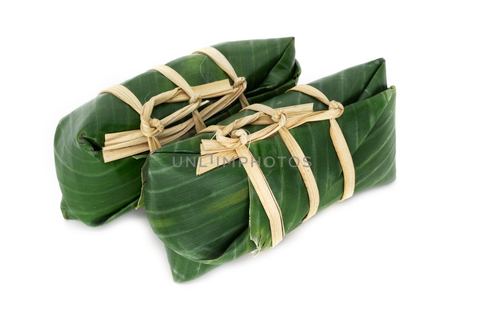 Sticky Rice In Banana Leaf, traditional thai food on white background