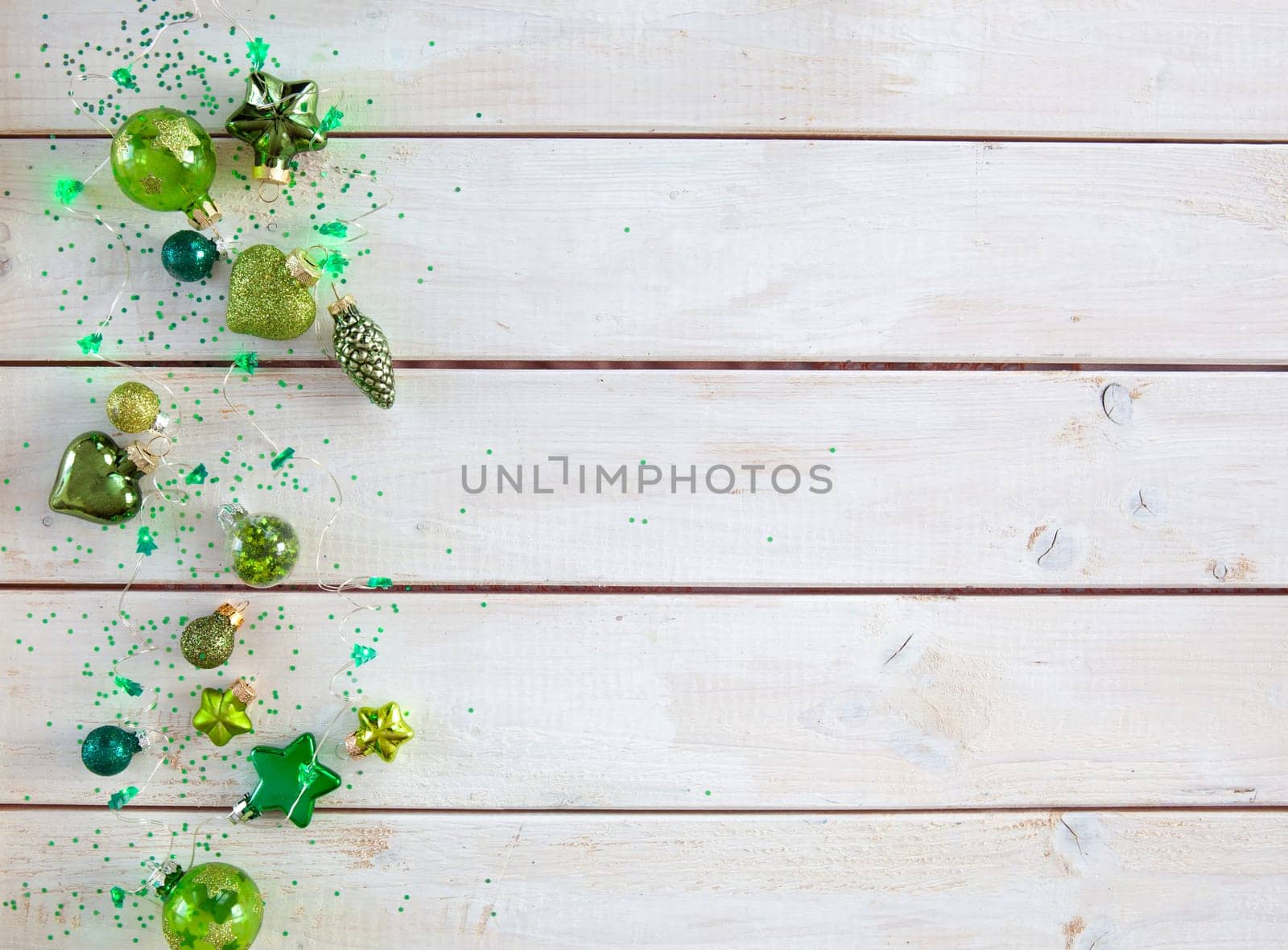 Cheerful decorations and ornaments in various green tones for Christmas