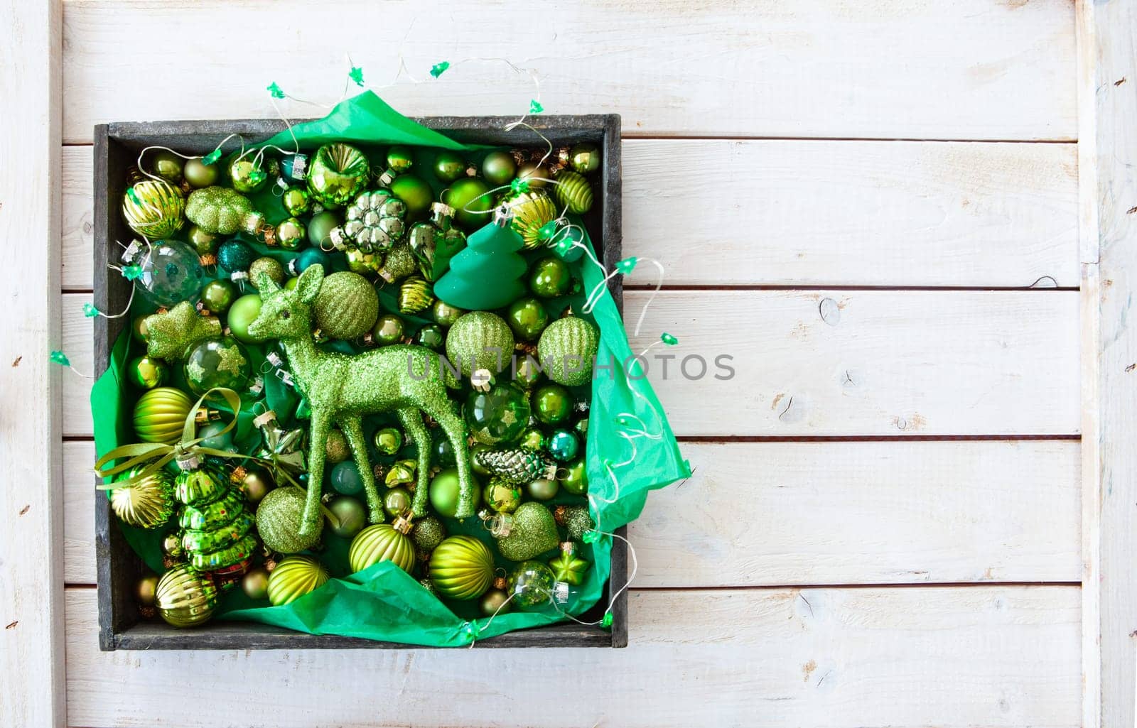 Cheerful decorations and ornaments in various green tones for Christmas