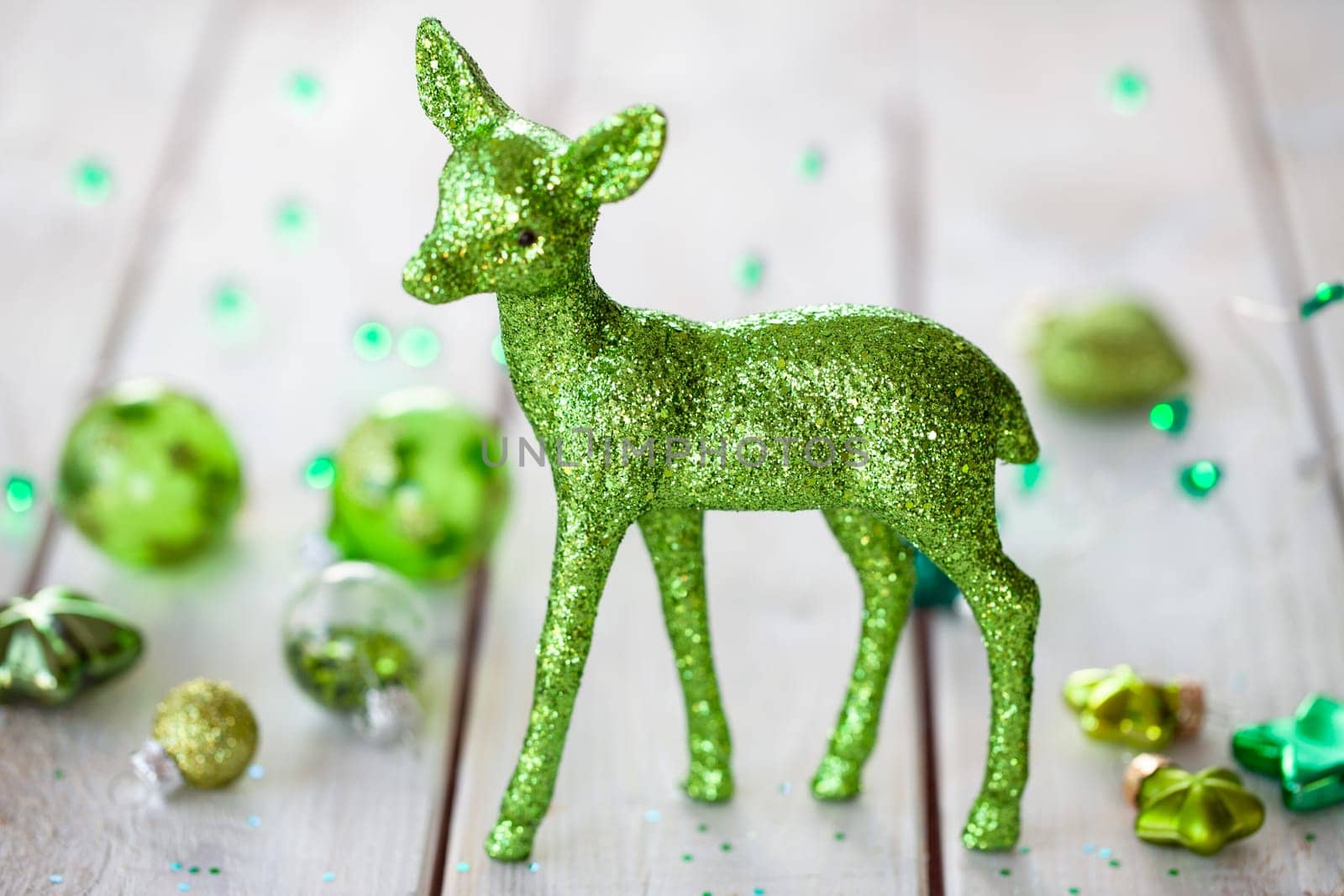 Cheerful decorations and ornaments in various green tones for Christmas