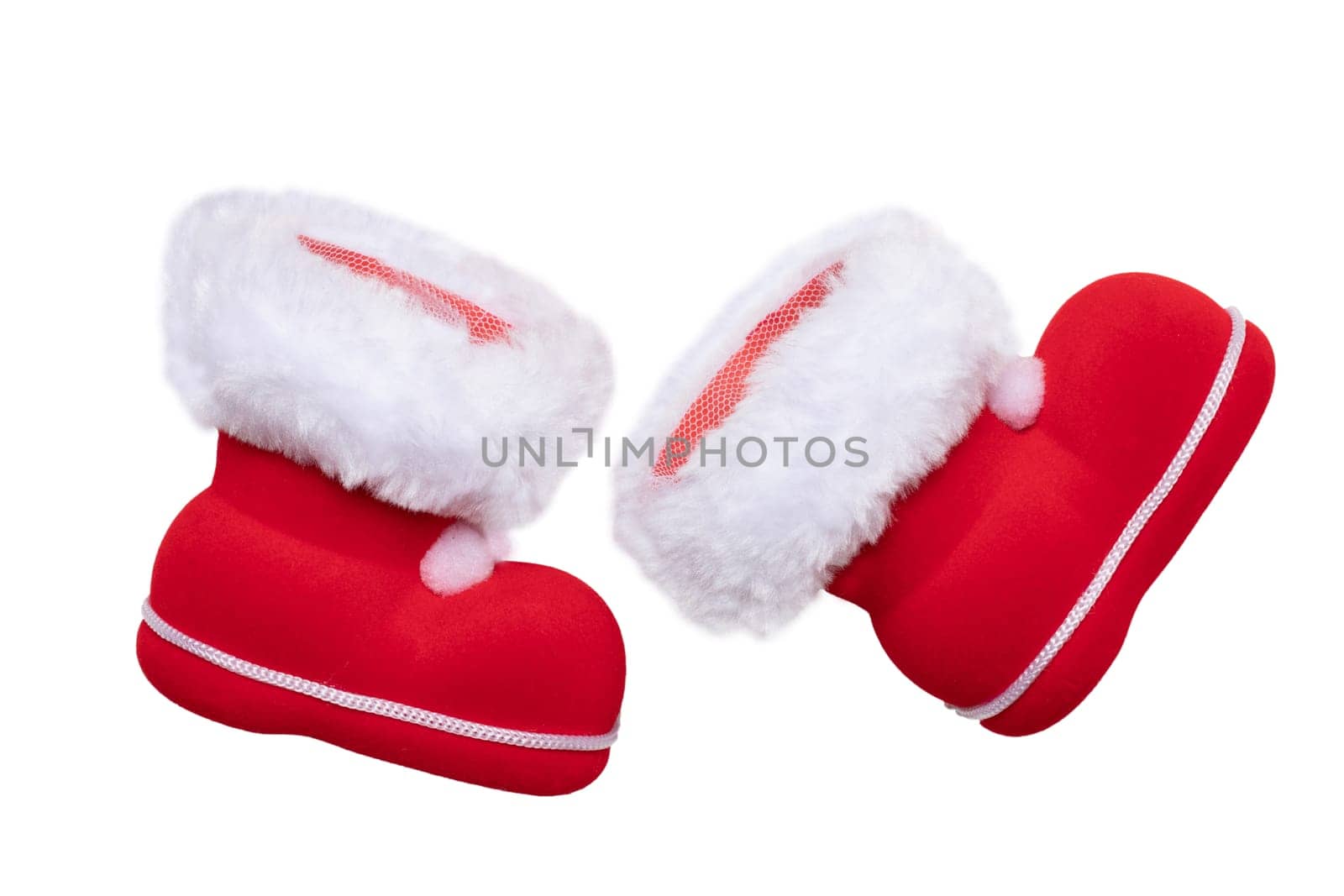 Christmas decorations. A pair of red Christmas boots or Santa Claus boots isolated on a white background.