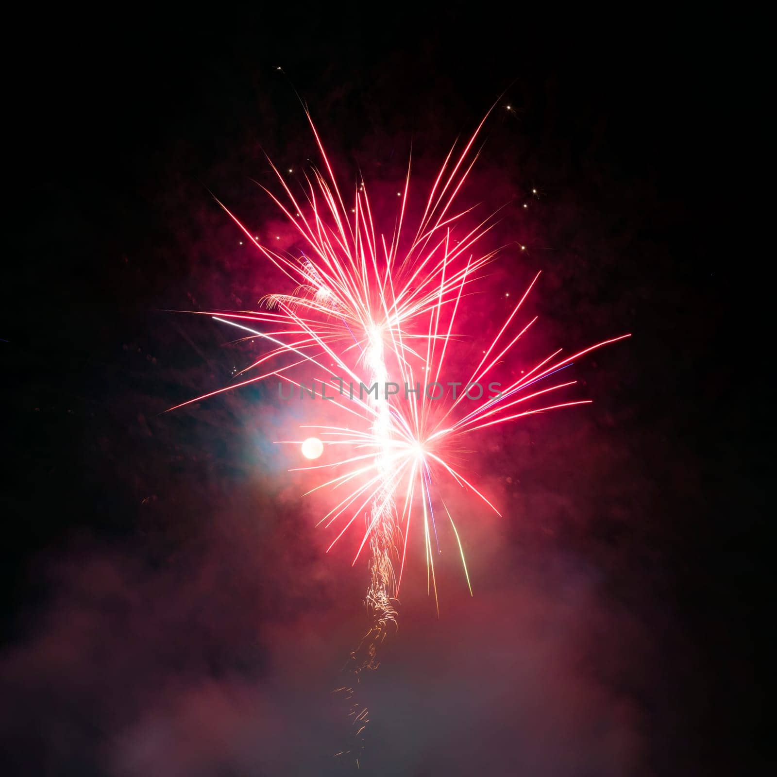 Fireworks display over dark sky