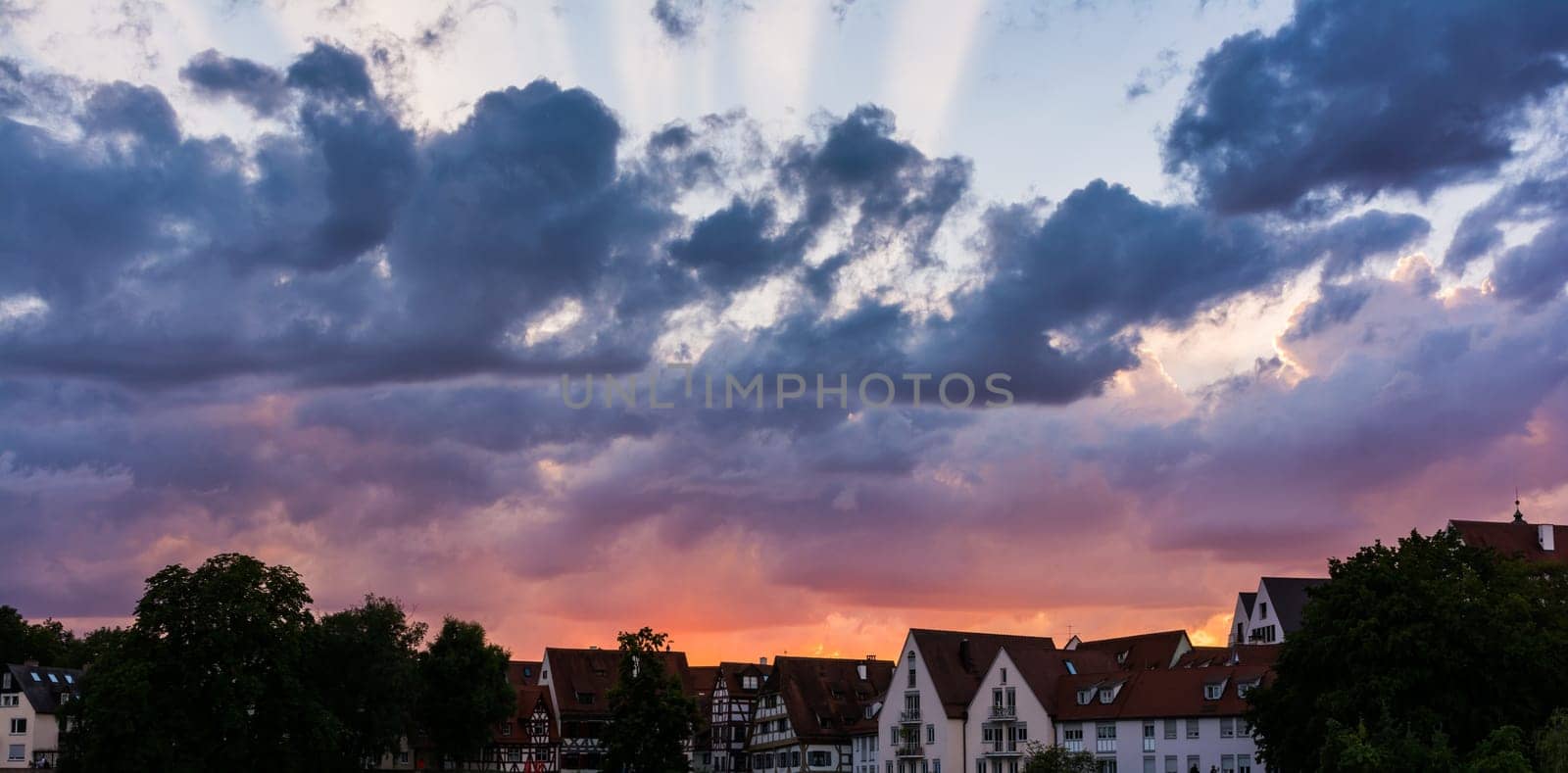 Deep Burning Red Purple Blue Ray Sunset over German Cottages in Ulm