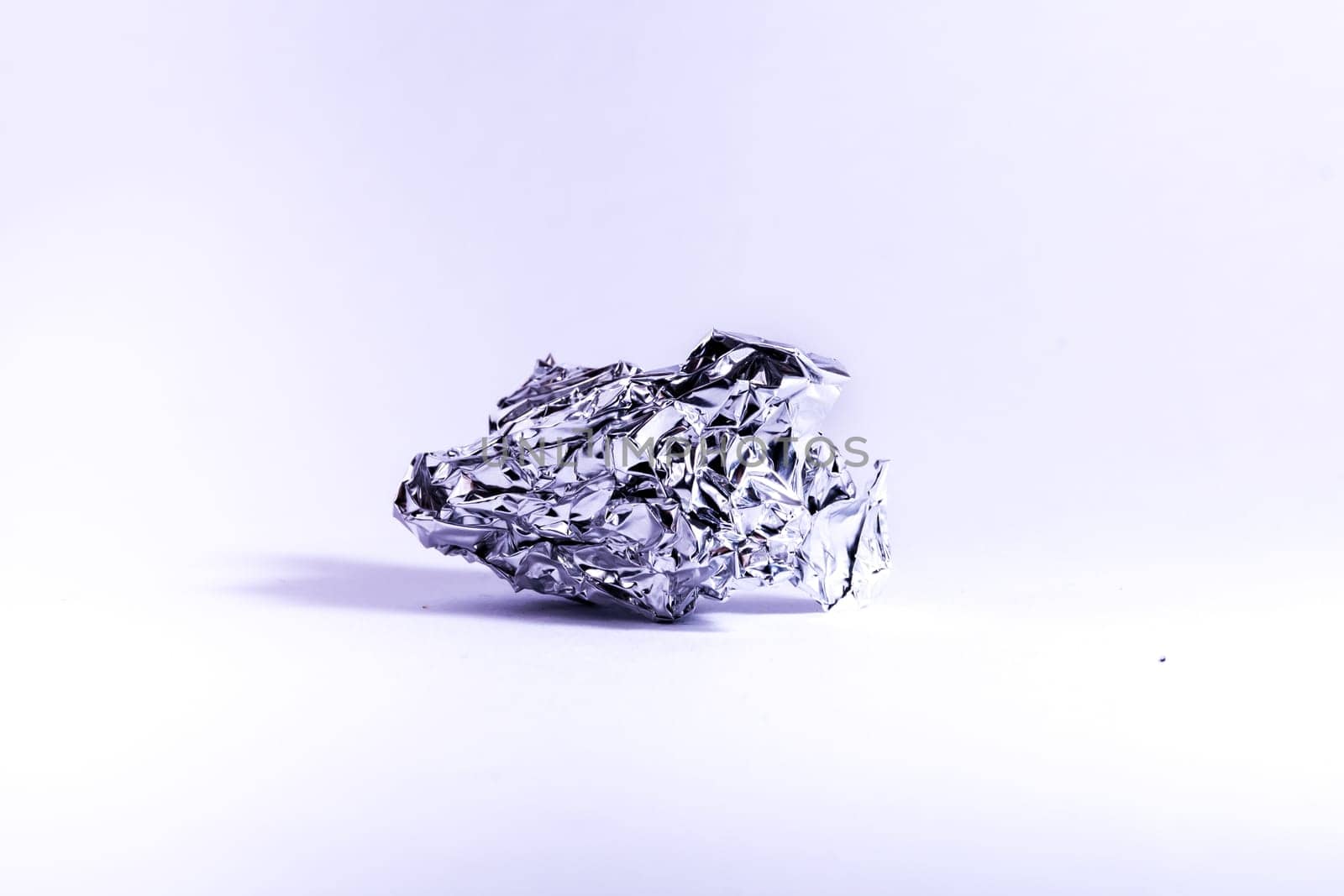 Aluminum Foil Crumpled Wrinkled Ball Shiny Metal White Background