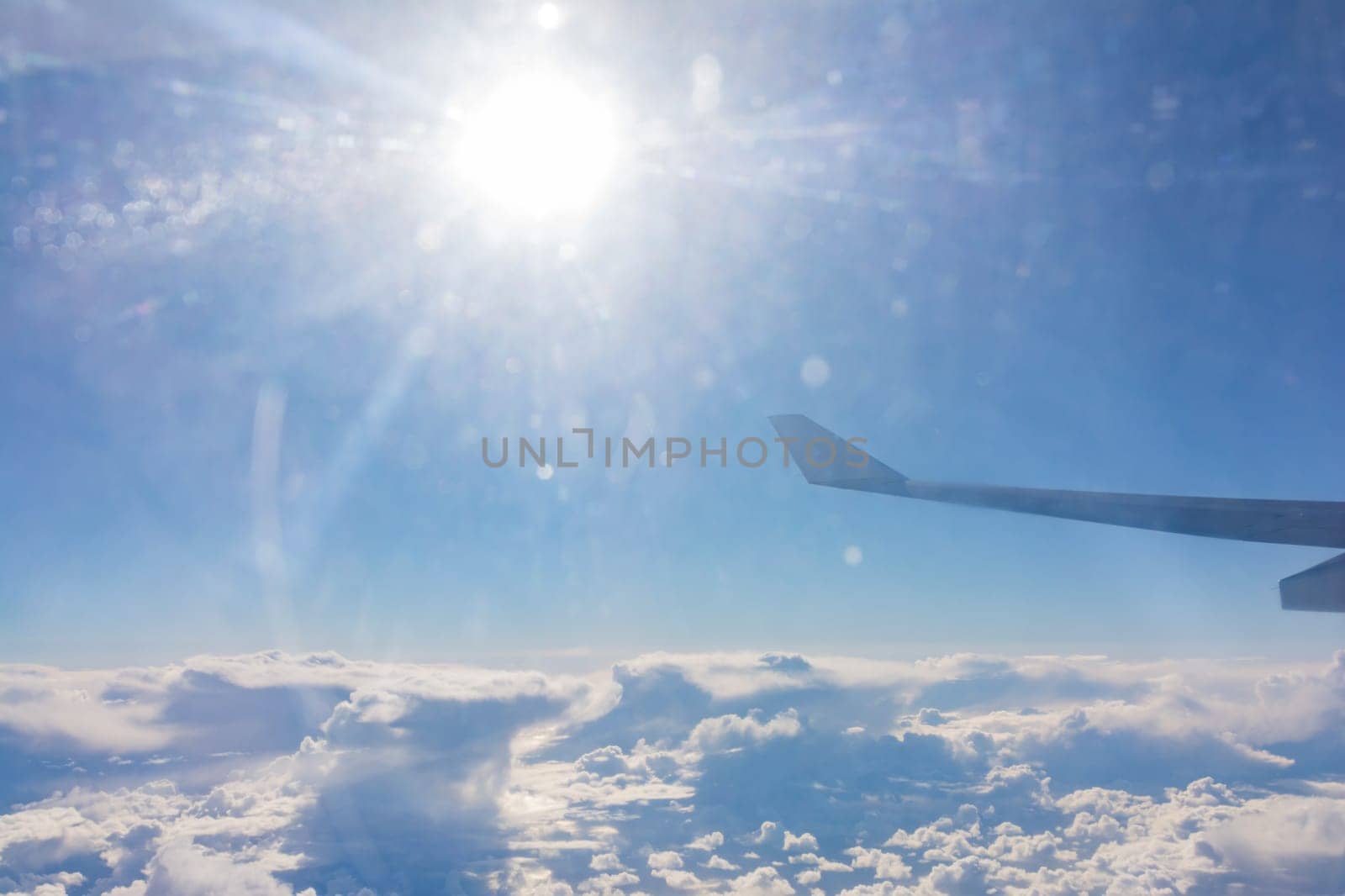 Airplane Wing Solar Flare Above Clouds Travel Blue Sky Day Airborne