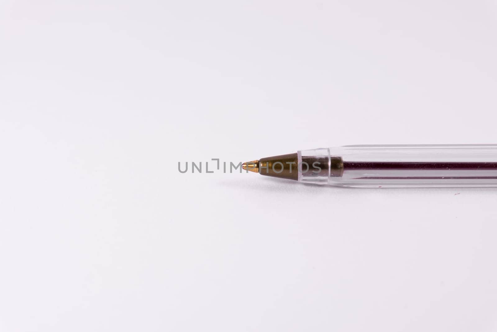 Red Pen Tip Cap Tube Plastic Clear Office Supply White Background Closeup