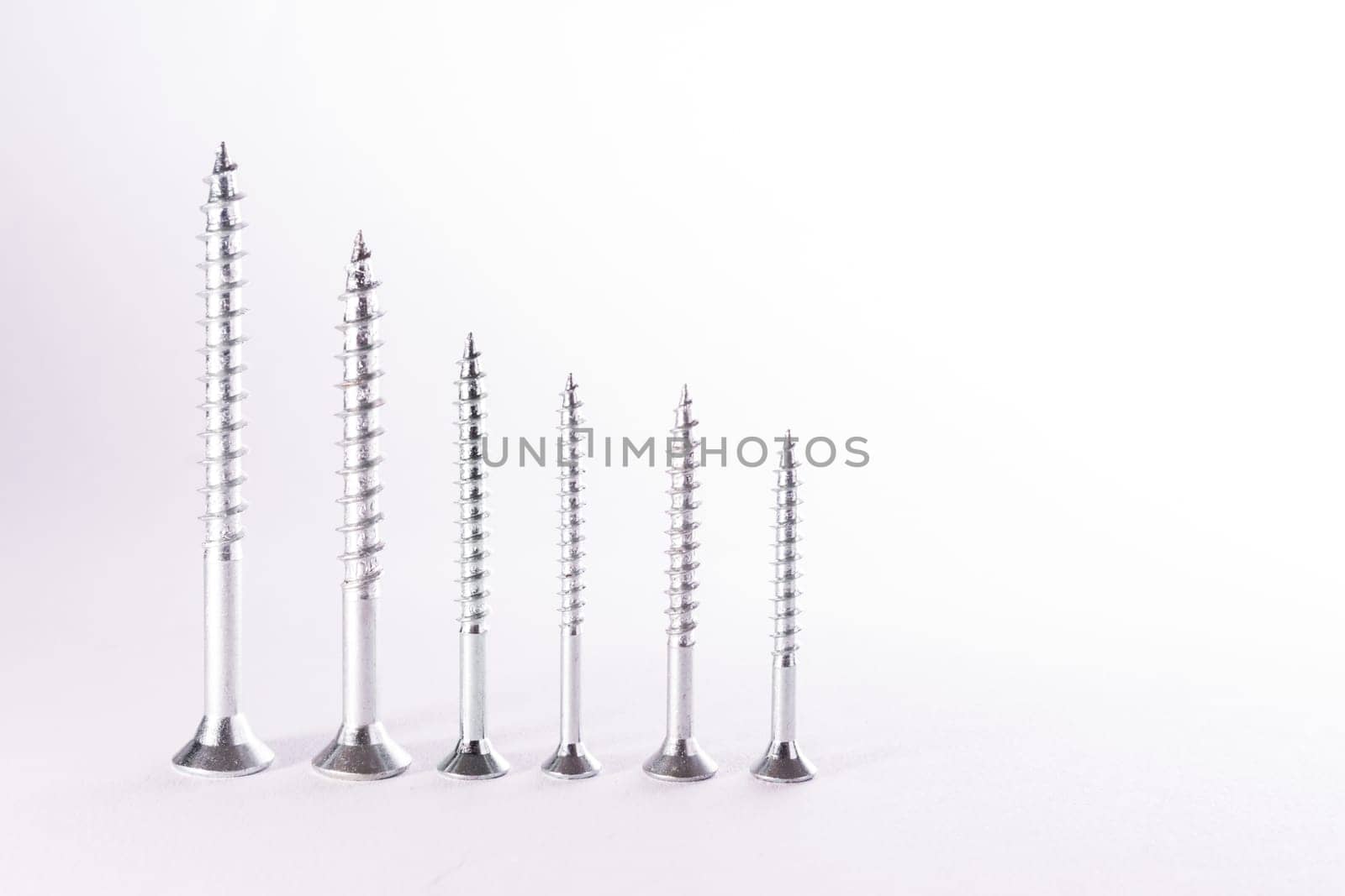 Decreasing Bar Graph Pattern Metal Screws Construction White Background