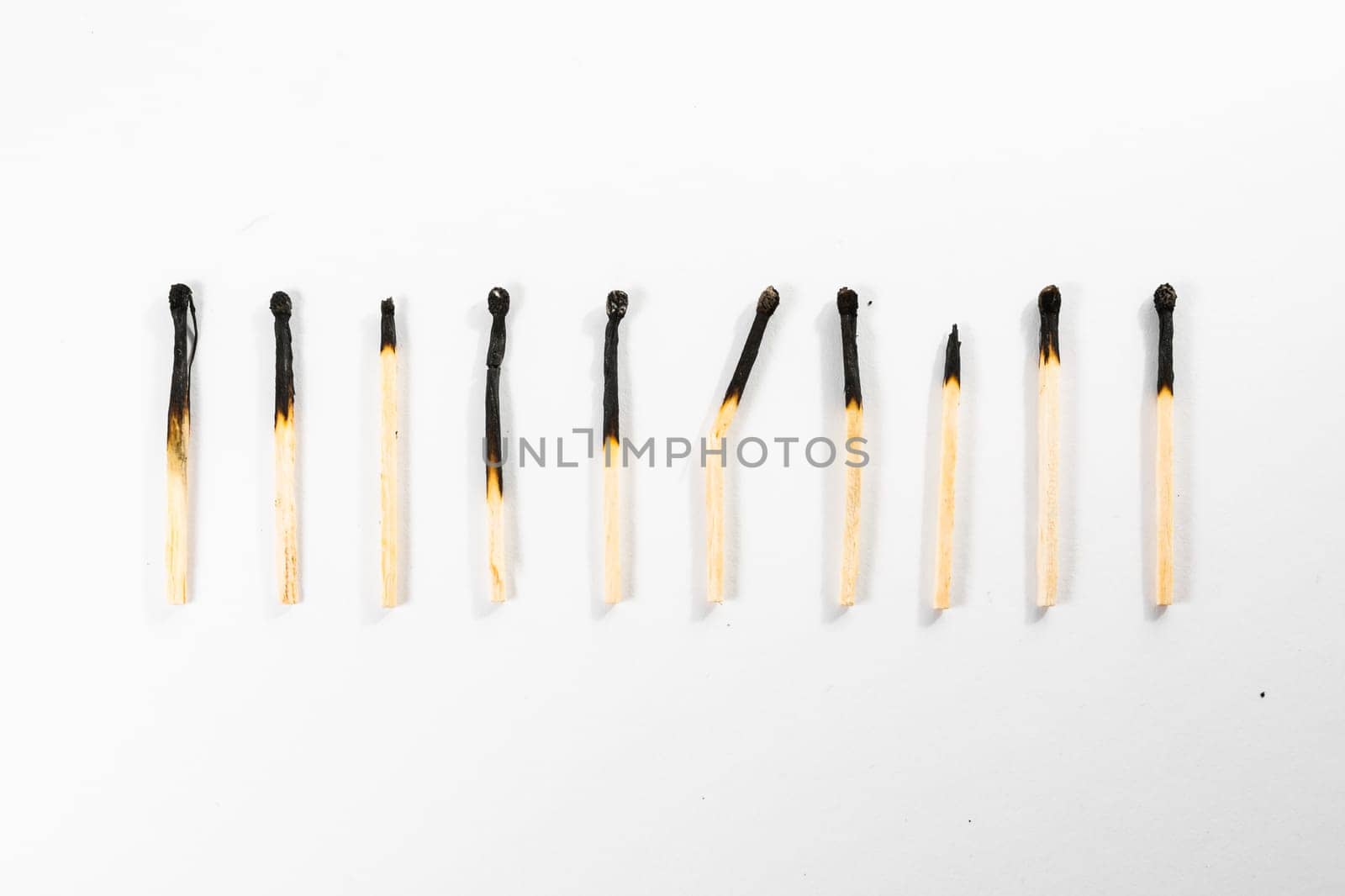 Match Stick Macro Detail Fire Symbol Safety White Isolated Background Charred Used Burned Burnt Black Wood Row Single Campfire