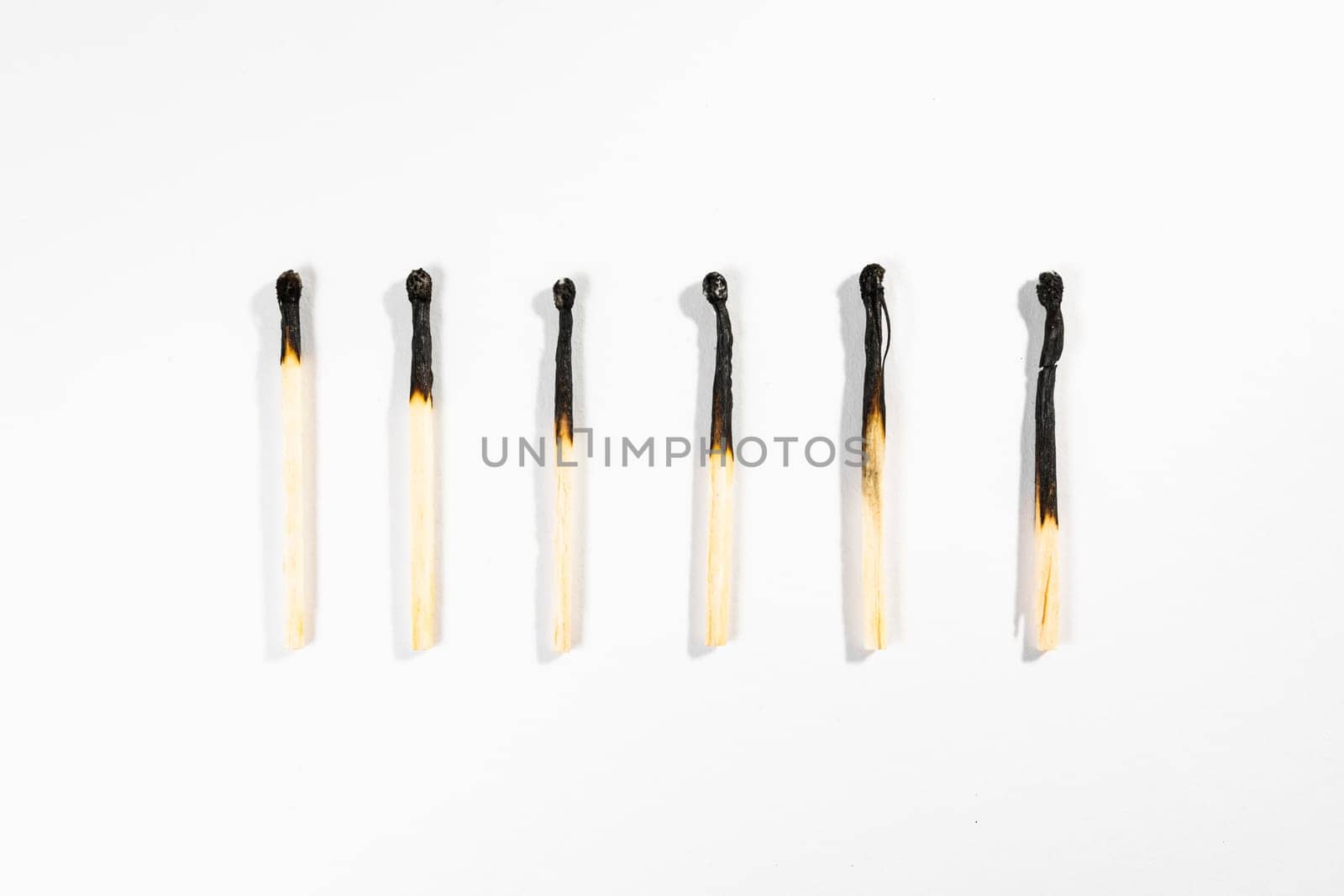 Match Stick Macro Detail Fire Symbol Safety White Isolated Background Charred Used Burned Burnt Black Wood Row Single Campfire