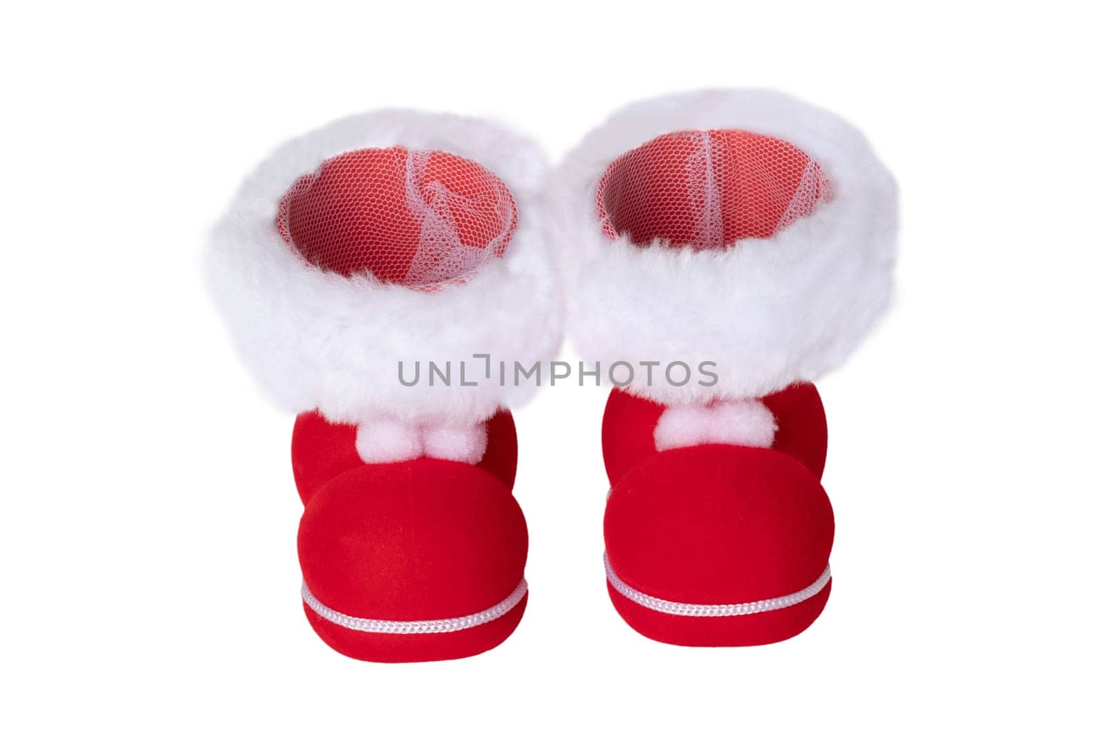 Christmas decorations. A pair of red Christmas boots or Santa Claus boots isolated on a white background.