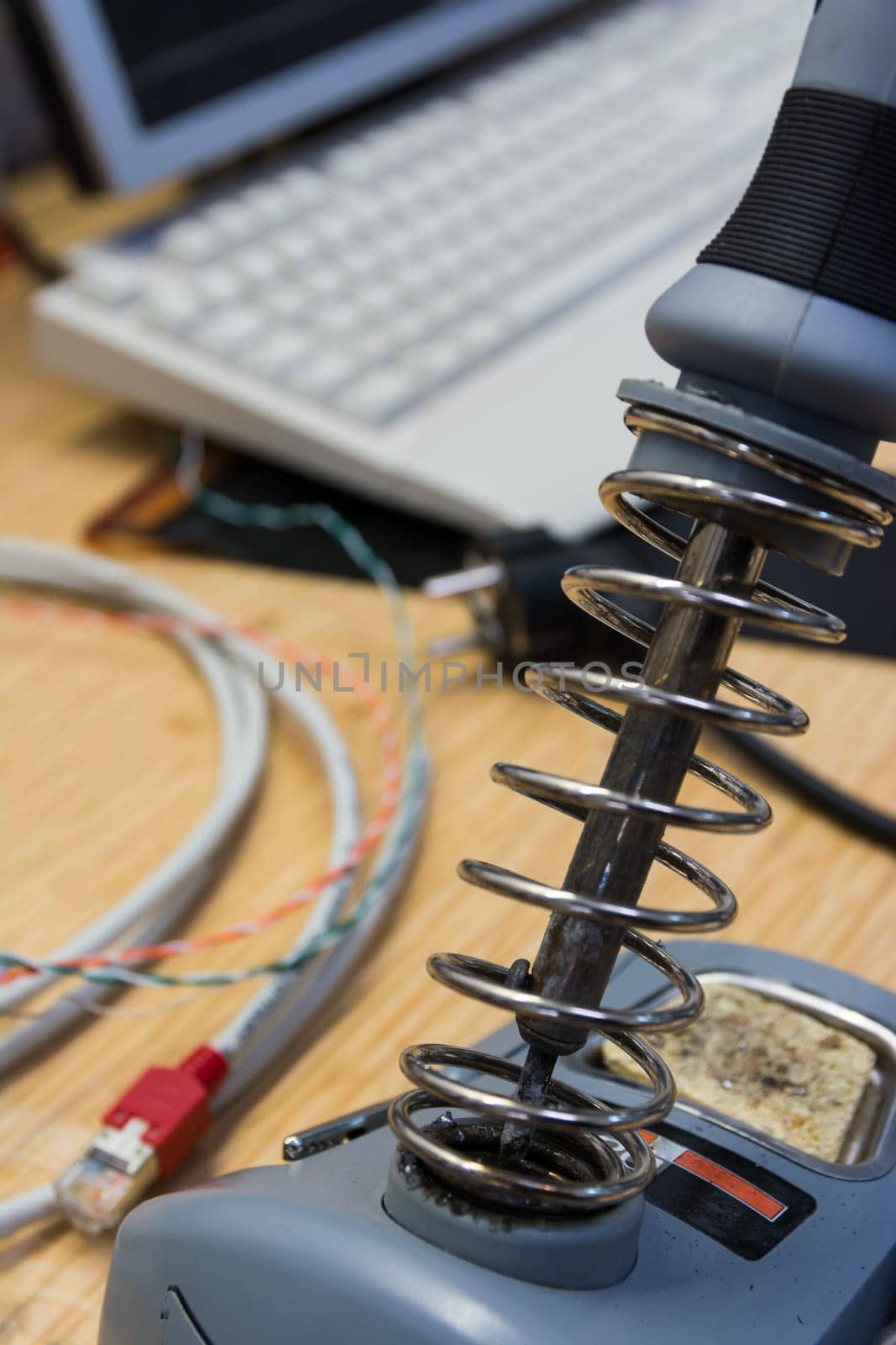 Soldering Iron Closeup Engineering Workspace Desk Electronics Metal Coil Stand Idle