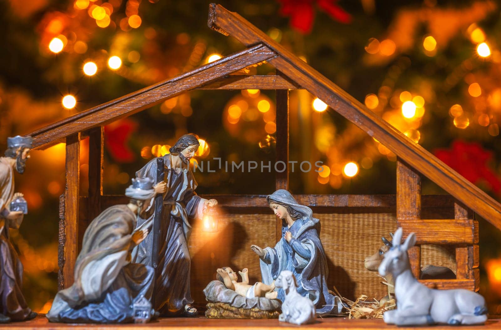 Christmas Manger scene with figurines including Jesus, Mary, Joseph and sheep. Focus on mother!
