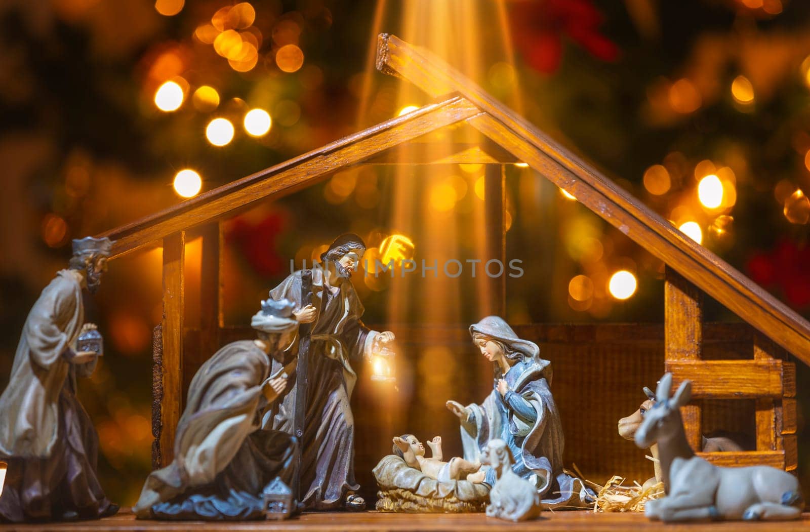 Christmas Manger scene with figurines including Jesus, Mary, Joseph, sheep and wise men. Focus on baby!