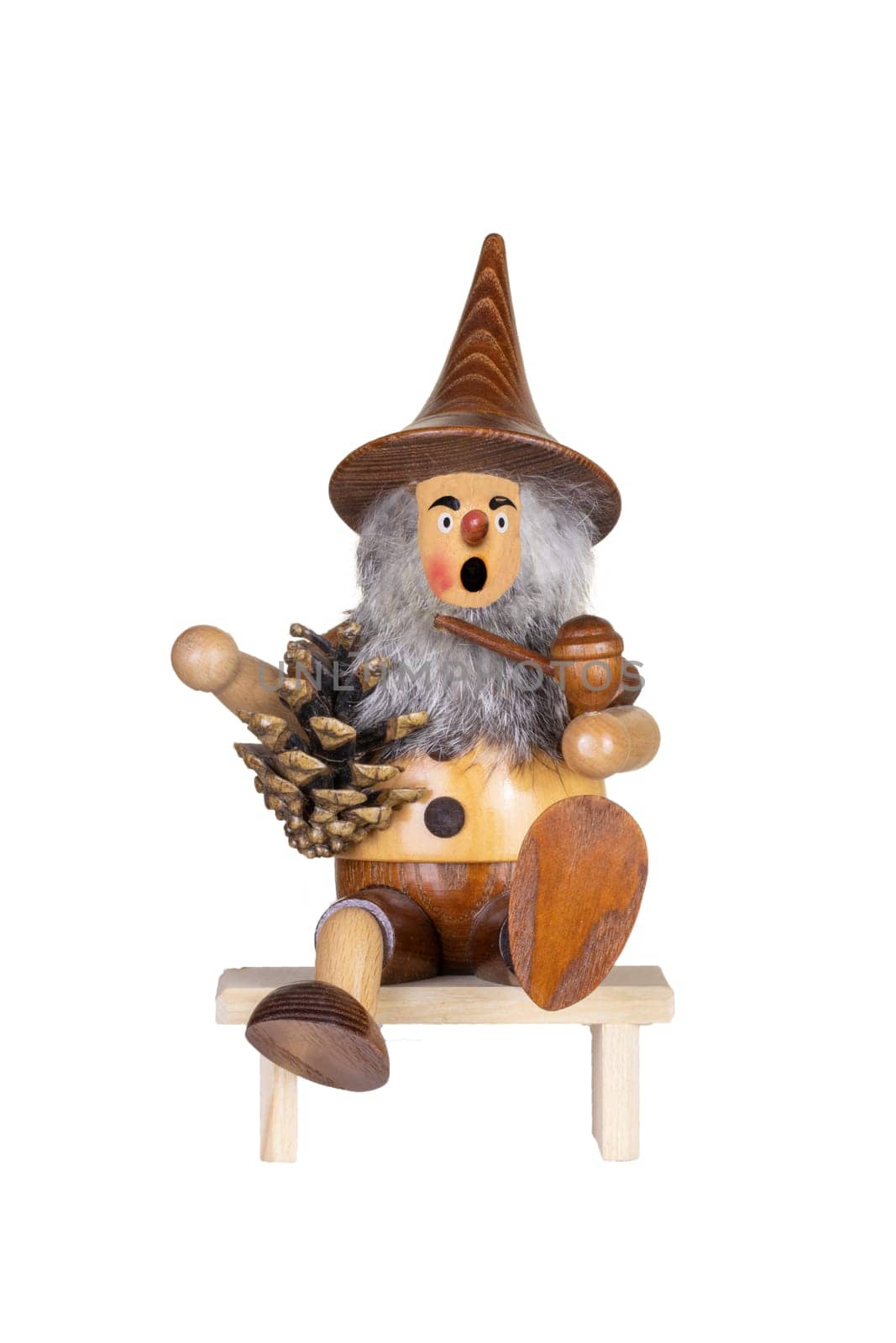 Christmas decoration background. Closeup of a wooden german Incense smoker. Traditional woodman decorations.