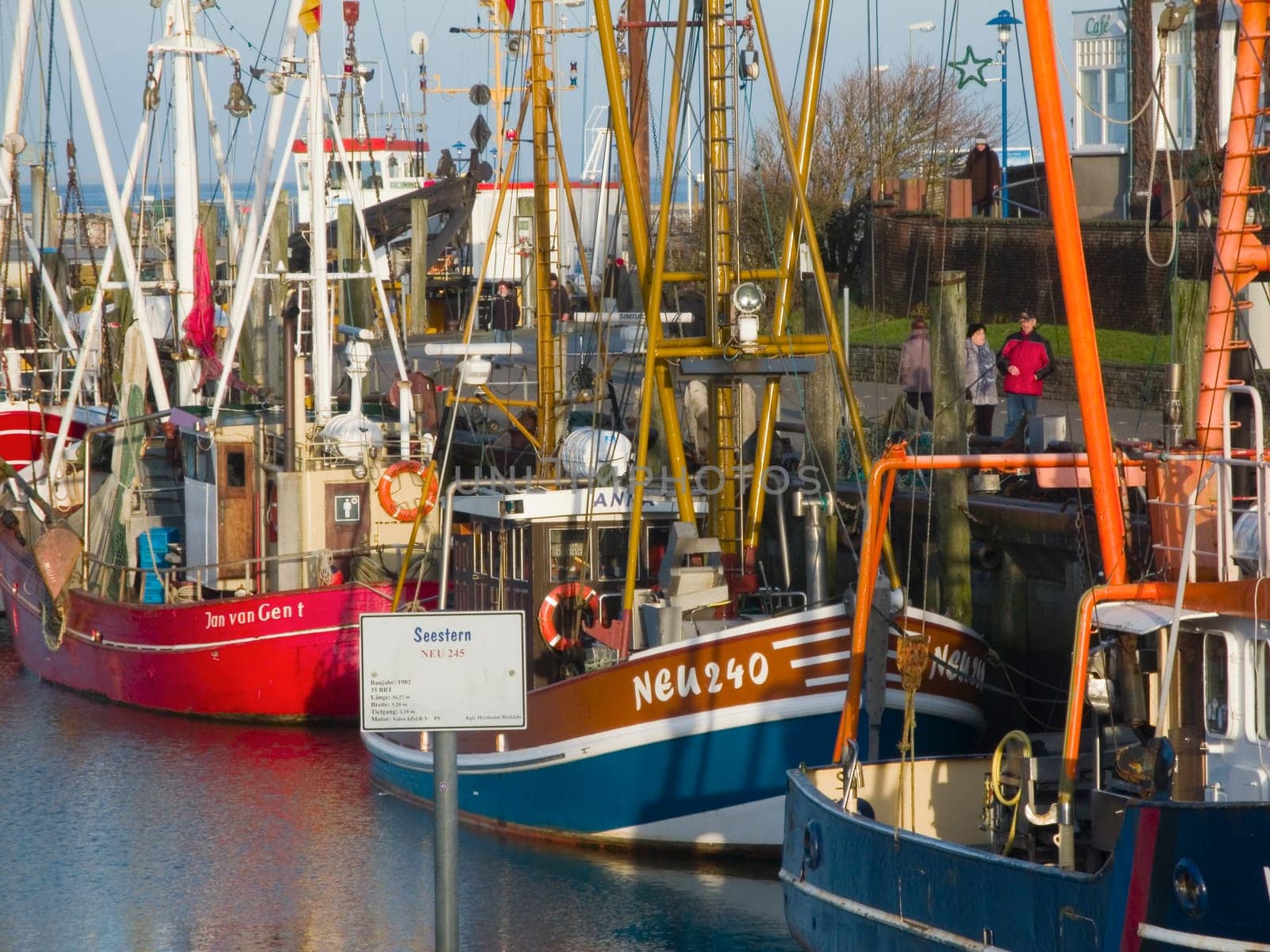 Neuharlingersiel,Germany - 01 January 2015: View of the port of Neuharlingersiel with various fish and pedestrians