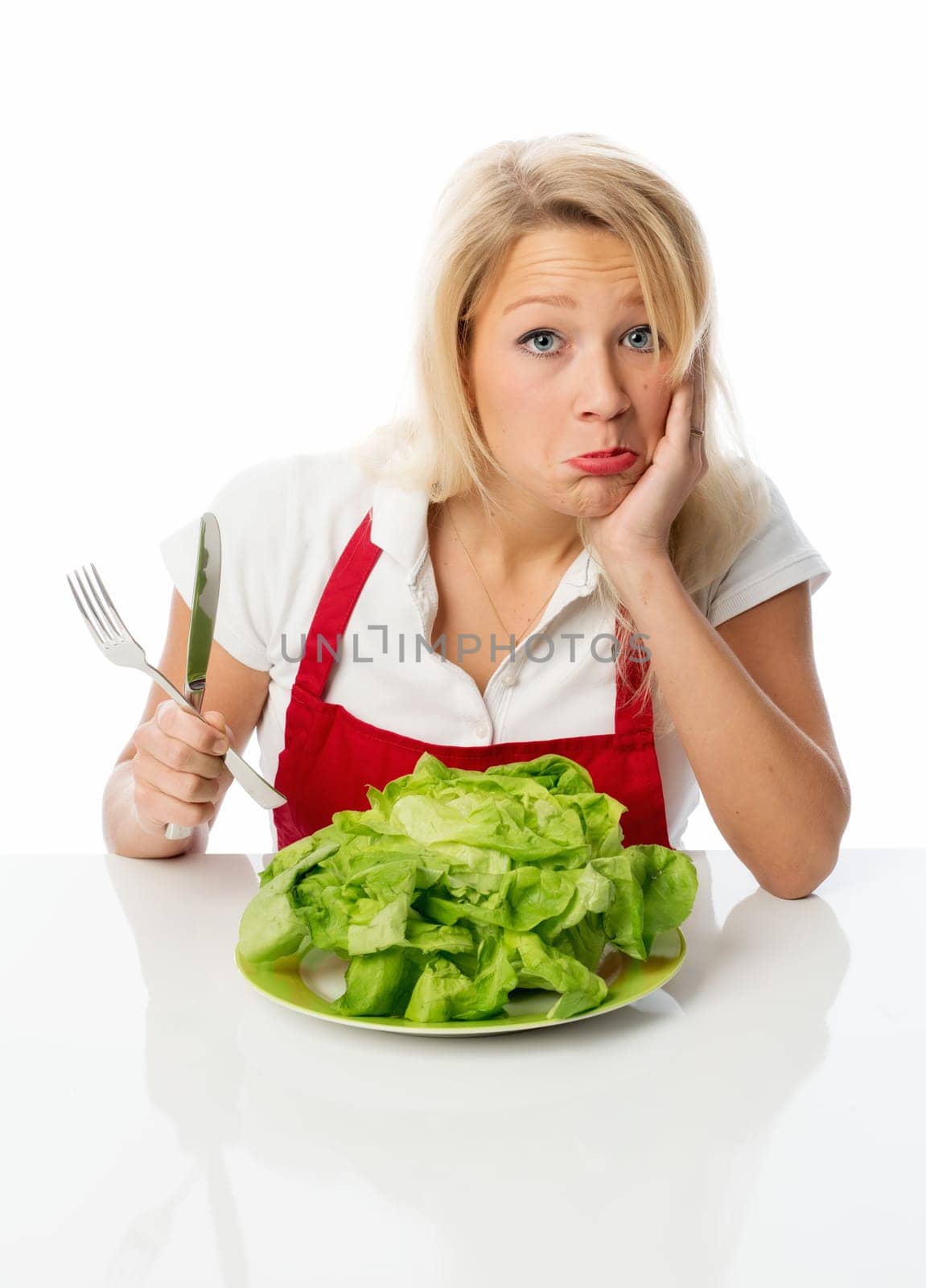 Blonde housewife presents a salad head