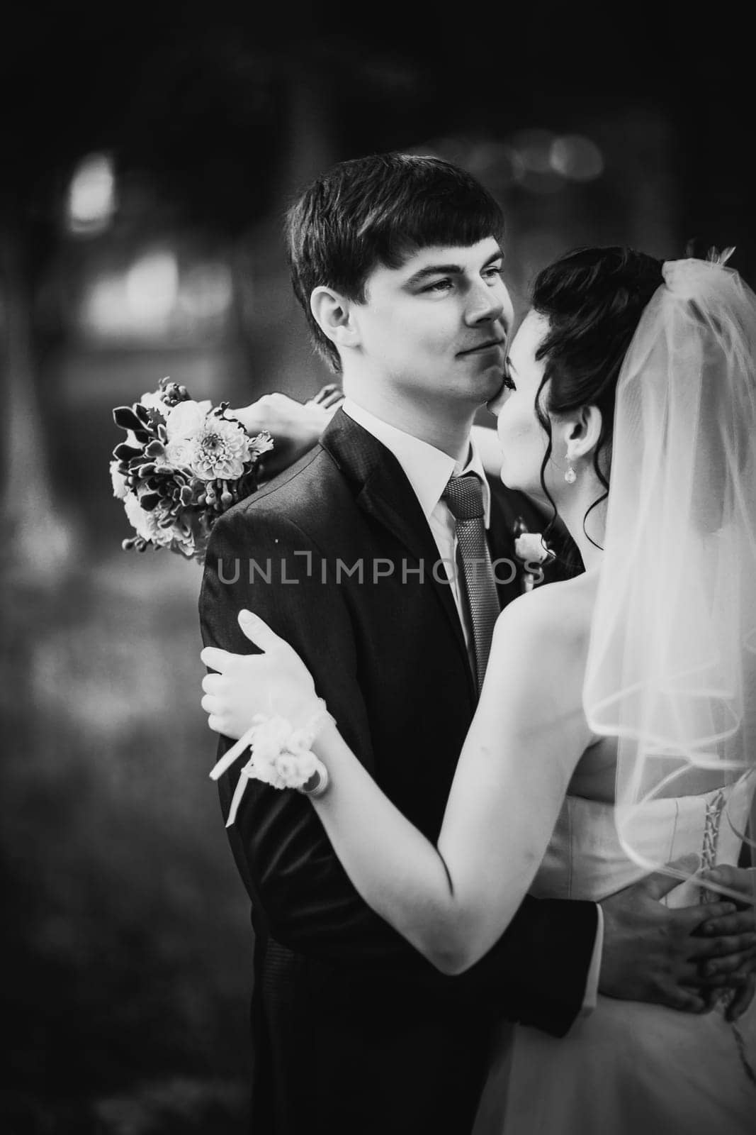 Black white photography wedding beautiful young couple stand on background forest