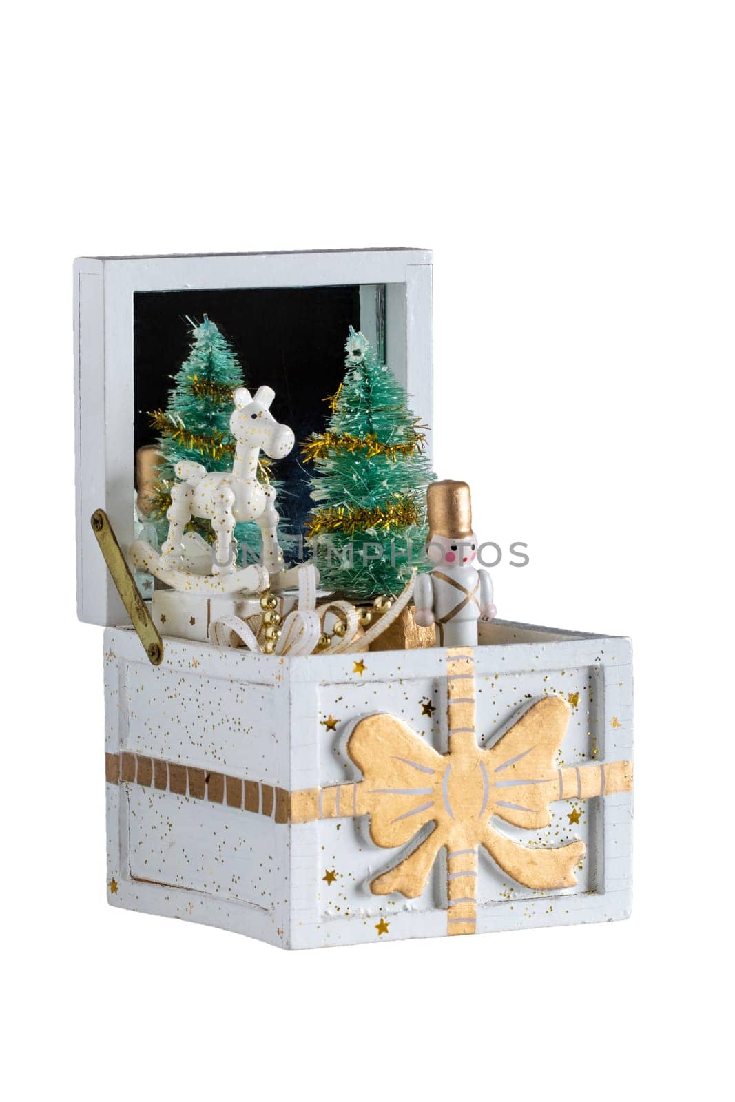 Christmas decorations background. Old wooden music box with a christmas song. The Christmas tree and the figures are moving. Christmas tree music box.