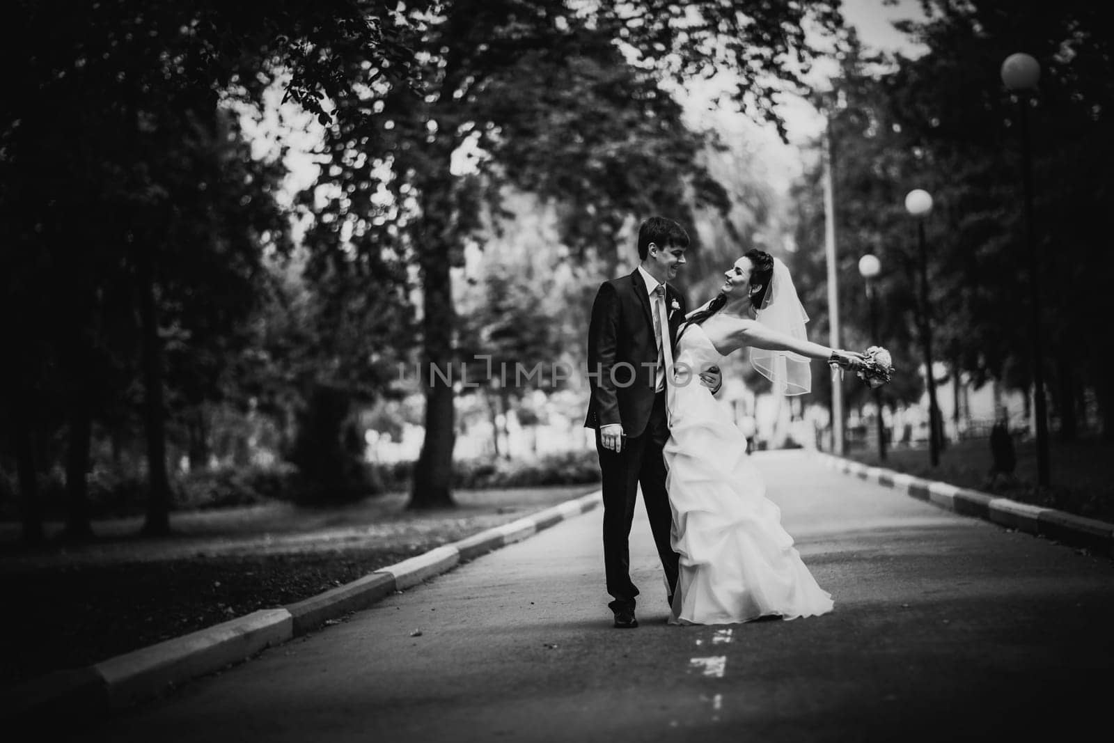 Black white photography beautiful young couple stand on background forest