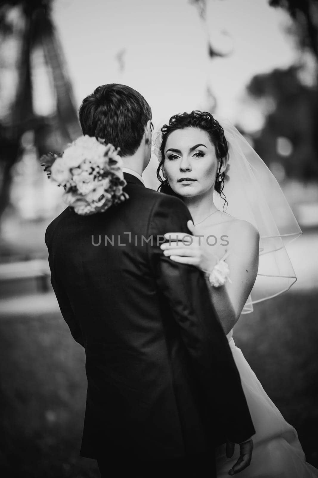 Black white photography wedding beautiful young couple stand on background forest