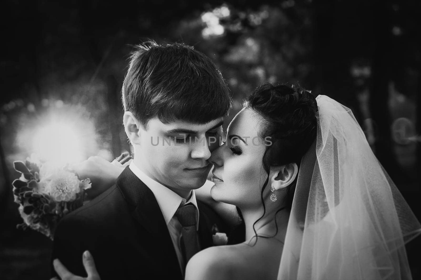 Black white photography wedding beautiful young couple stand on background forest