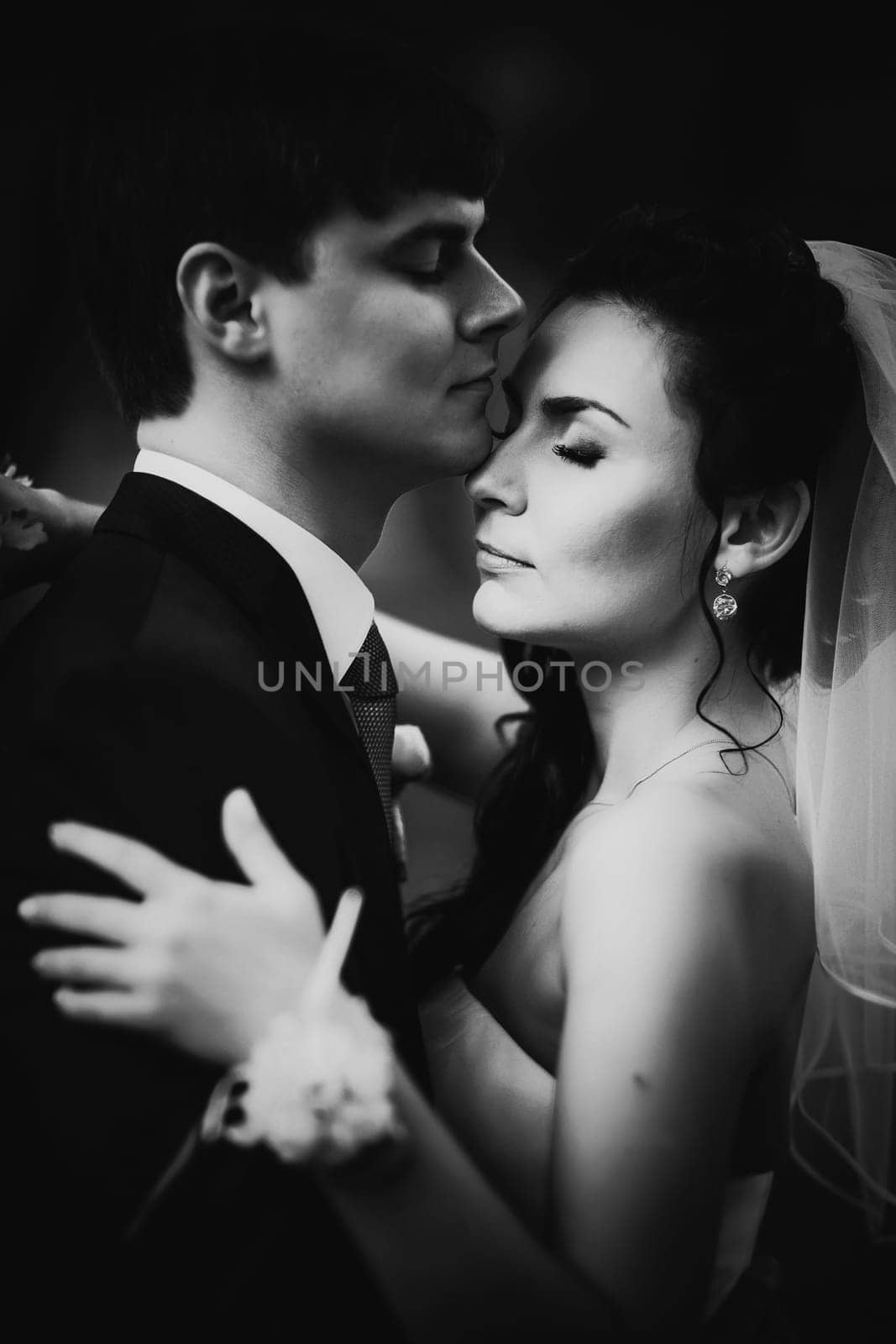 Black white photography wedding beautiful young couple stand on background forest