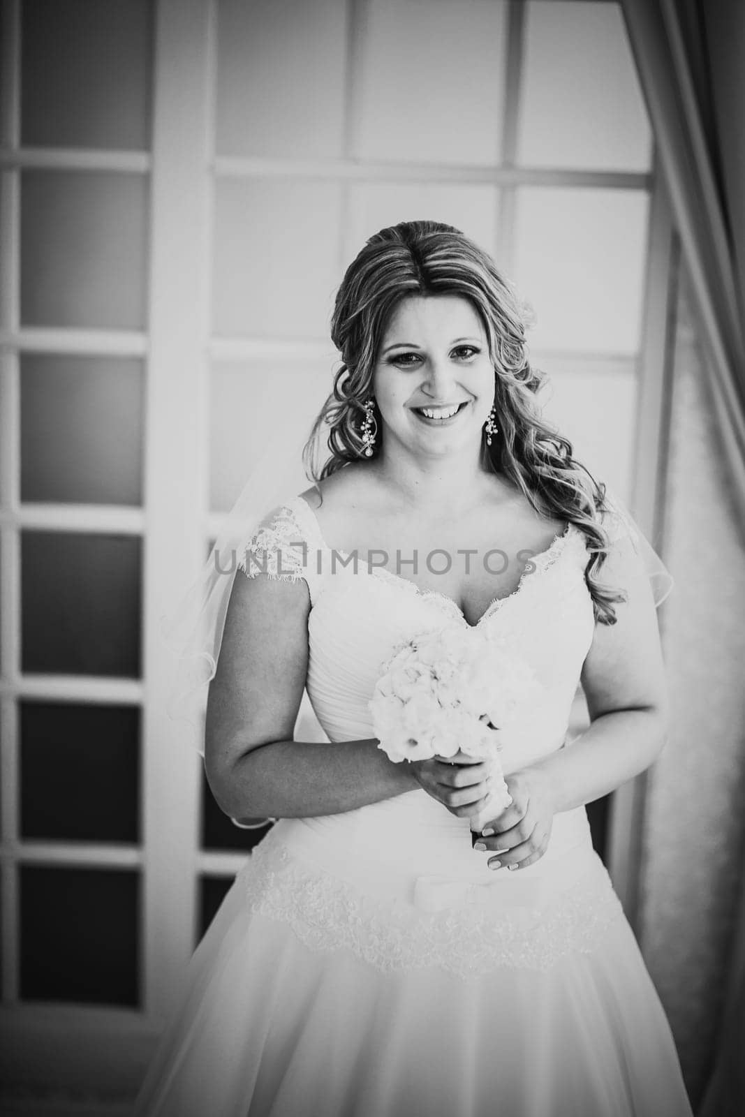 Black white photography elegance cute bride is posing on the background room