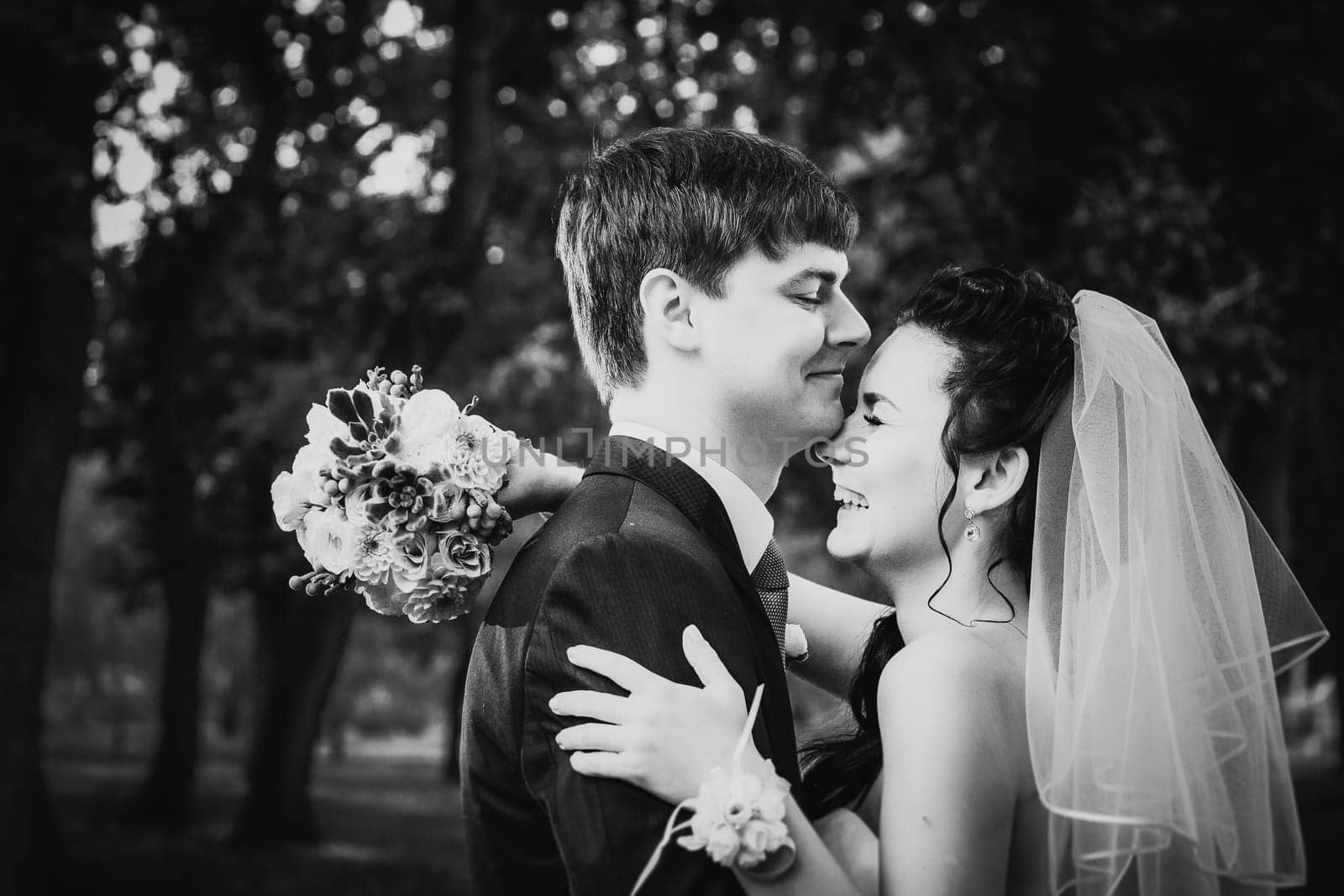 Black white photography wedding beautiful young couple stand on background forest