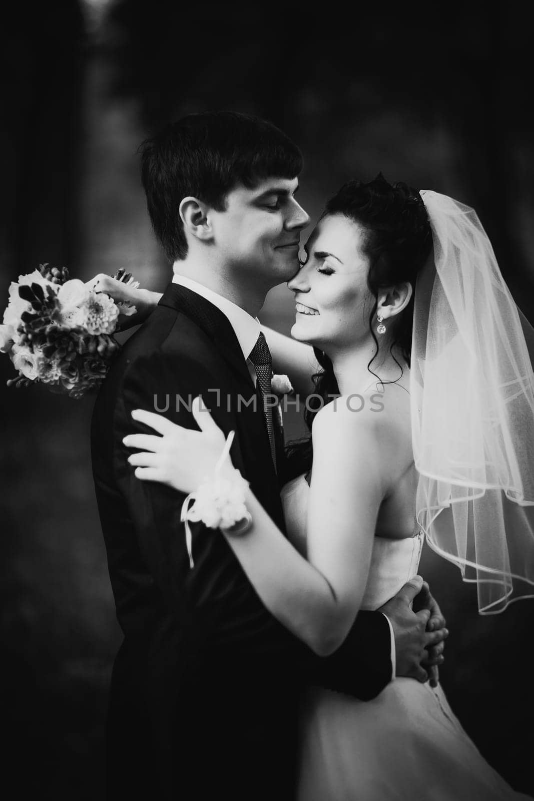 Black white photography wedding beautiful young couple stand on background forest