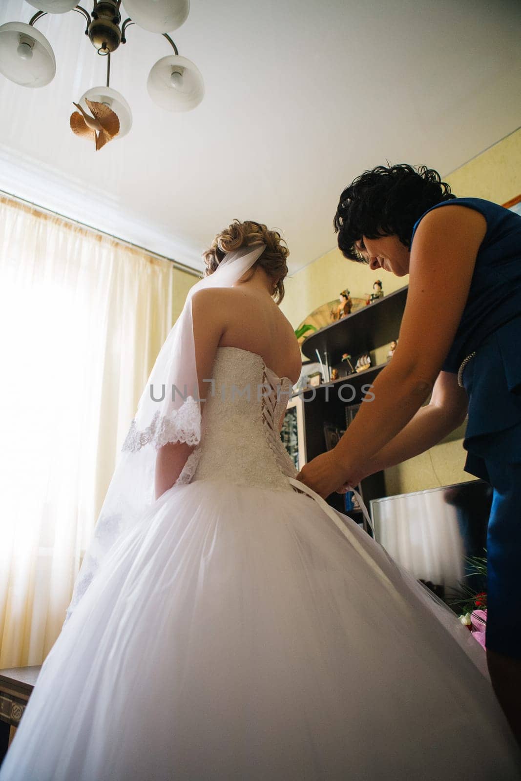 Mom puts young bride at a wedding