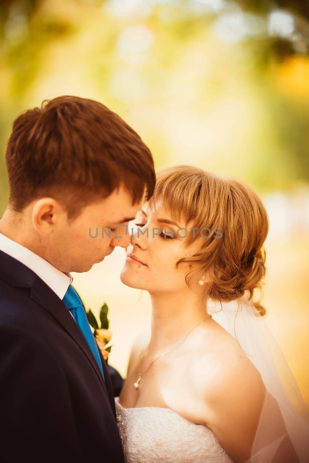 young bride and groom on the bluer background