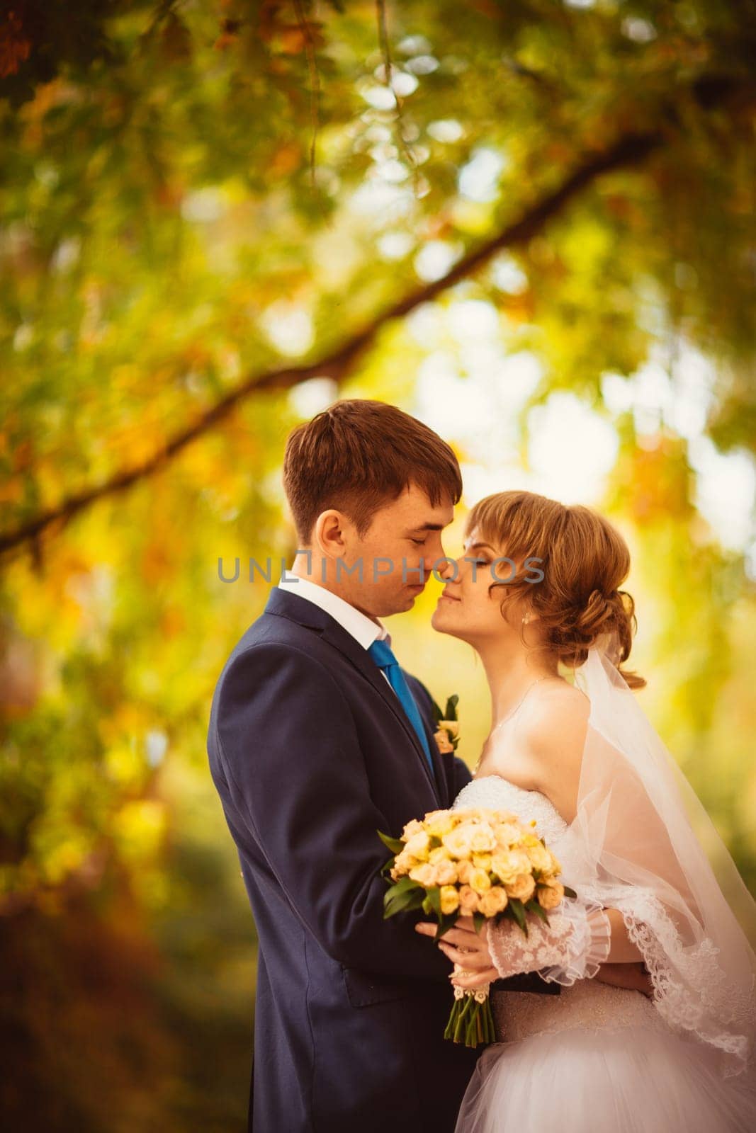 young bride and groom on the bluer background