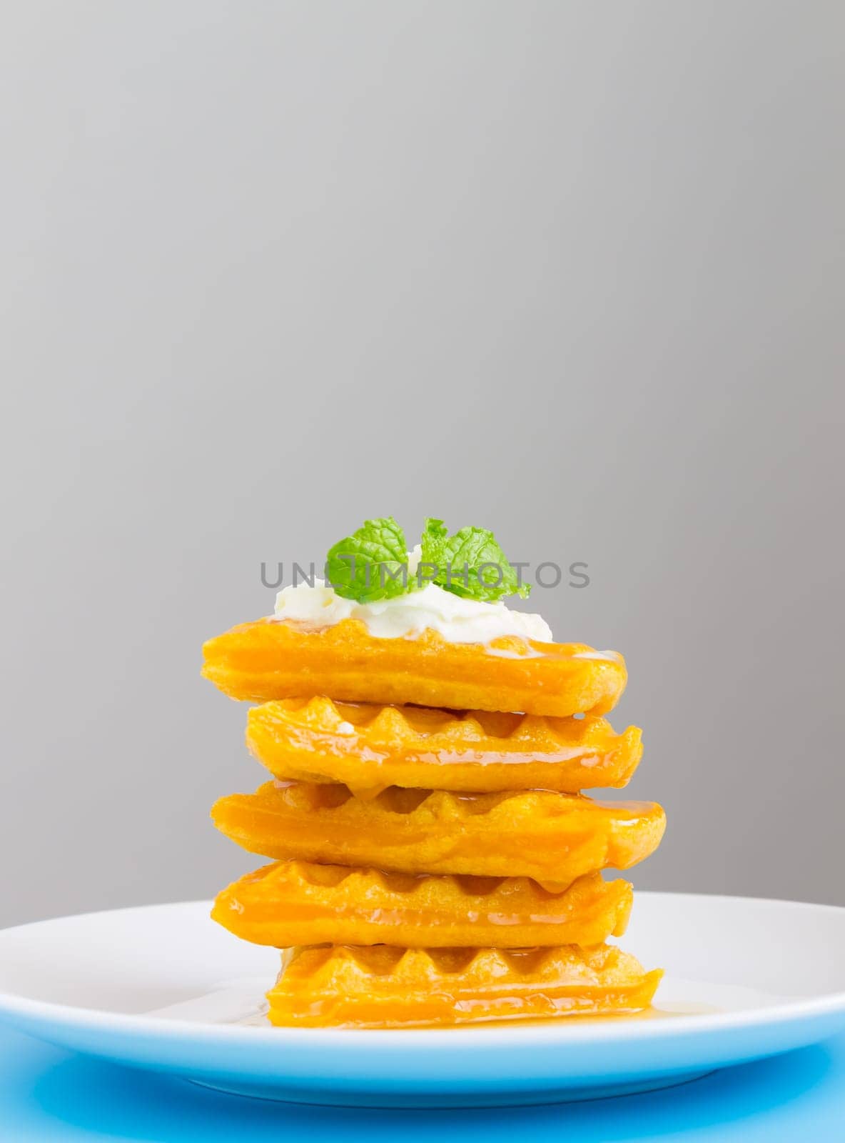 5 Pieces Heart Shape Waffle and Peppermint on Grey Background Portrait. Heart shape waffle dessert for food and dessert category