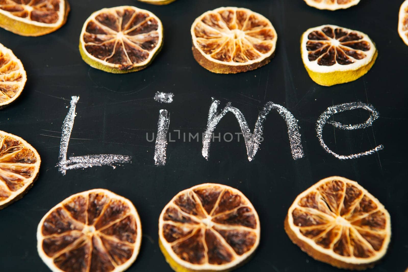 many cut orange circle on a black background board