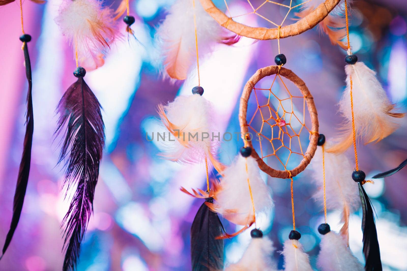 Dream catcher on the bright multicolored background