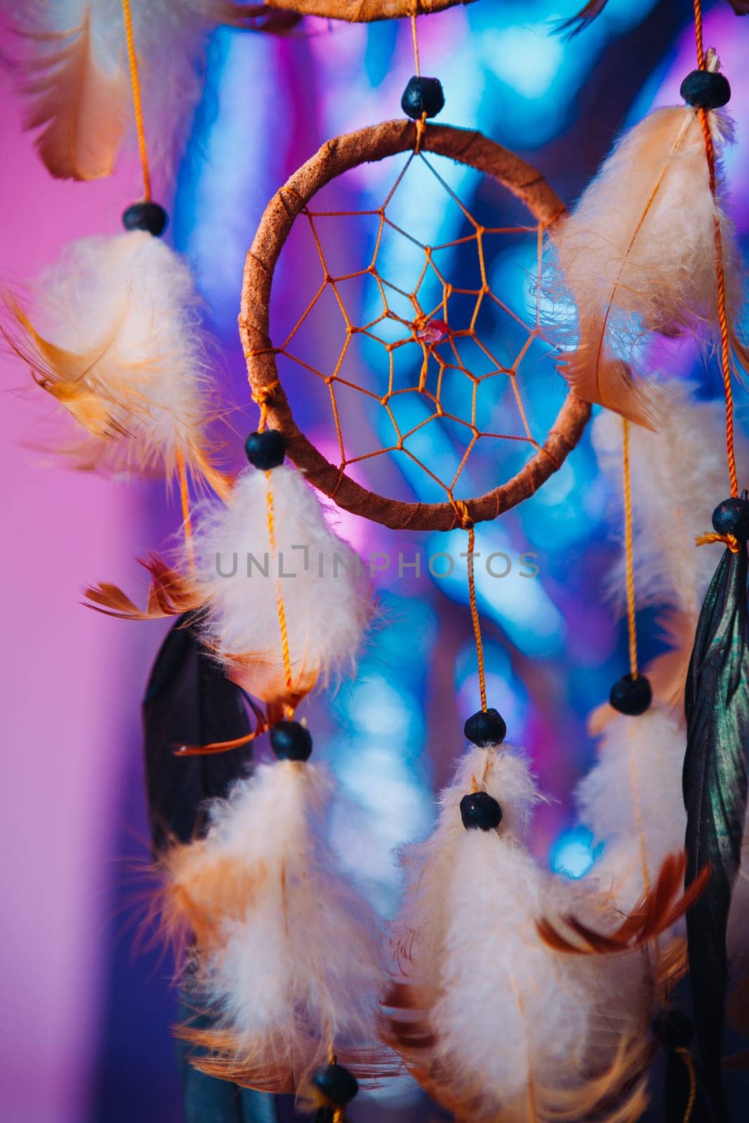 Dream catcher on the bright multicolored background