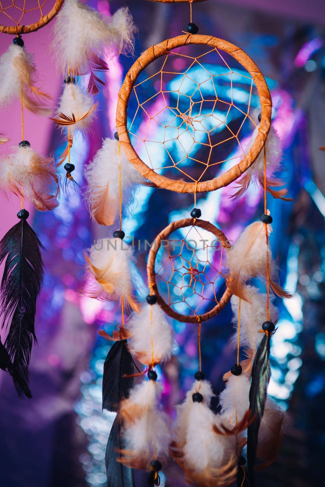 Dream catcher on the bright multicolored background