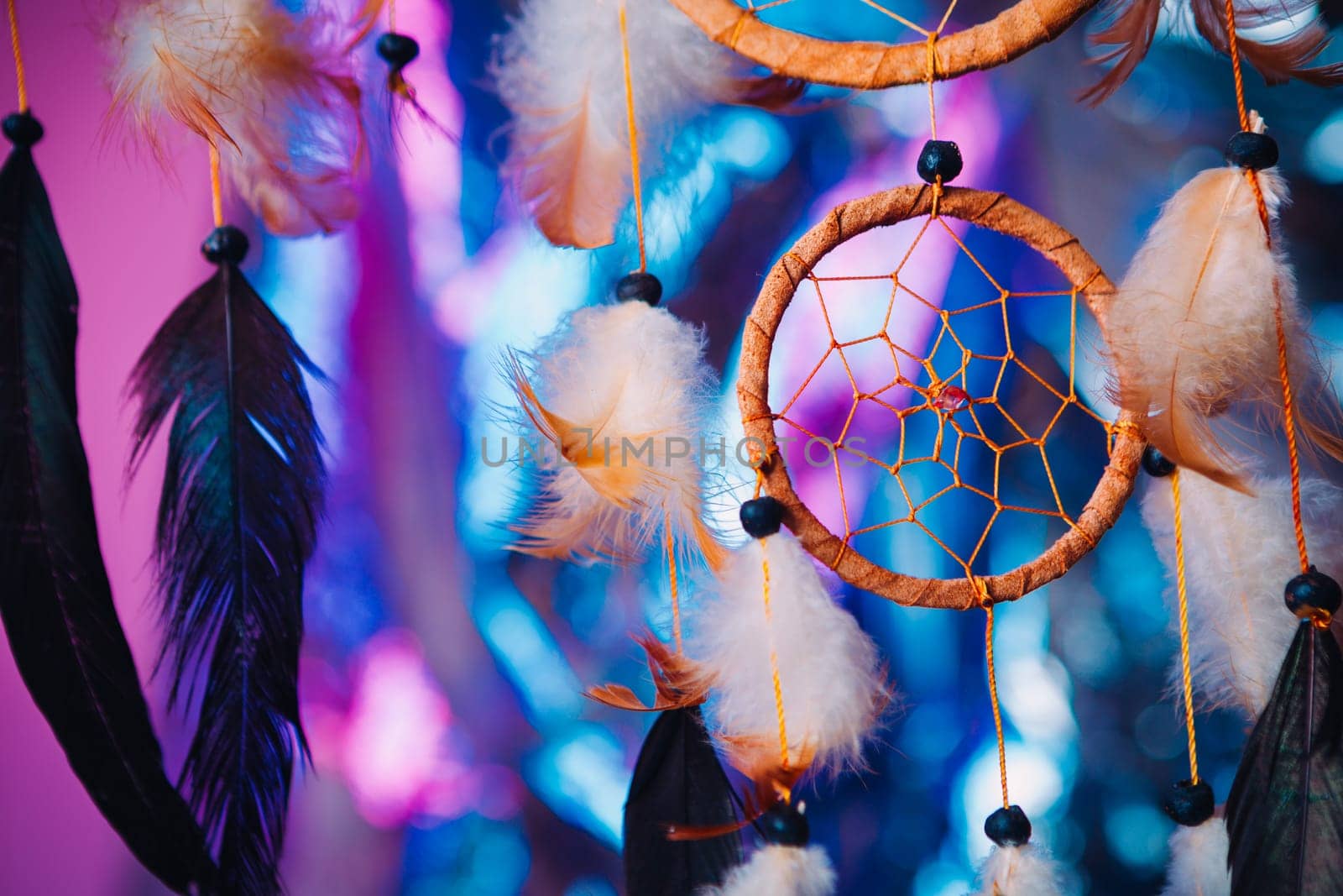 Dream catcher on the bright multicolored background