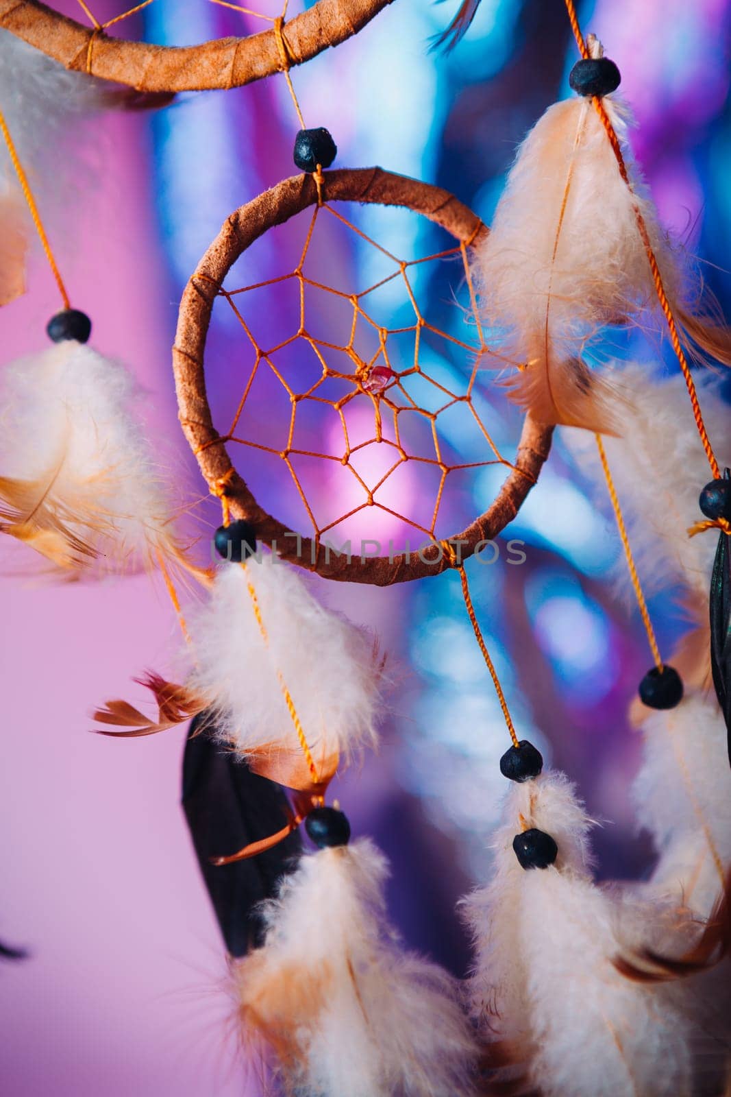 Dream catcher on the bright multicolored background