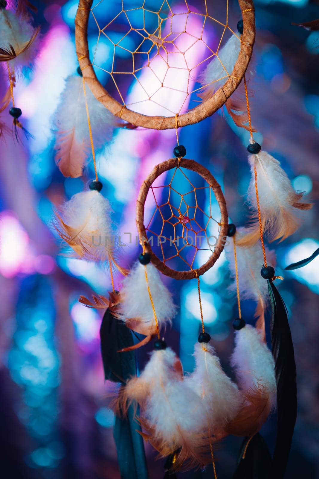 Dream catcher on the bright multicolored background